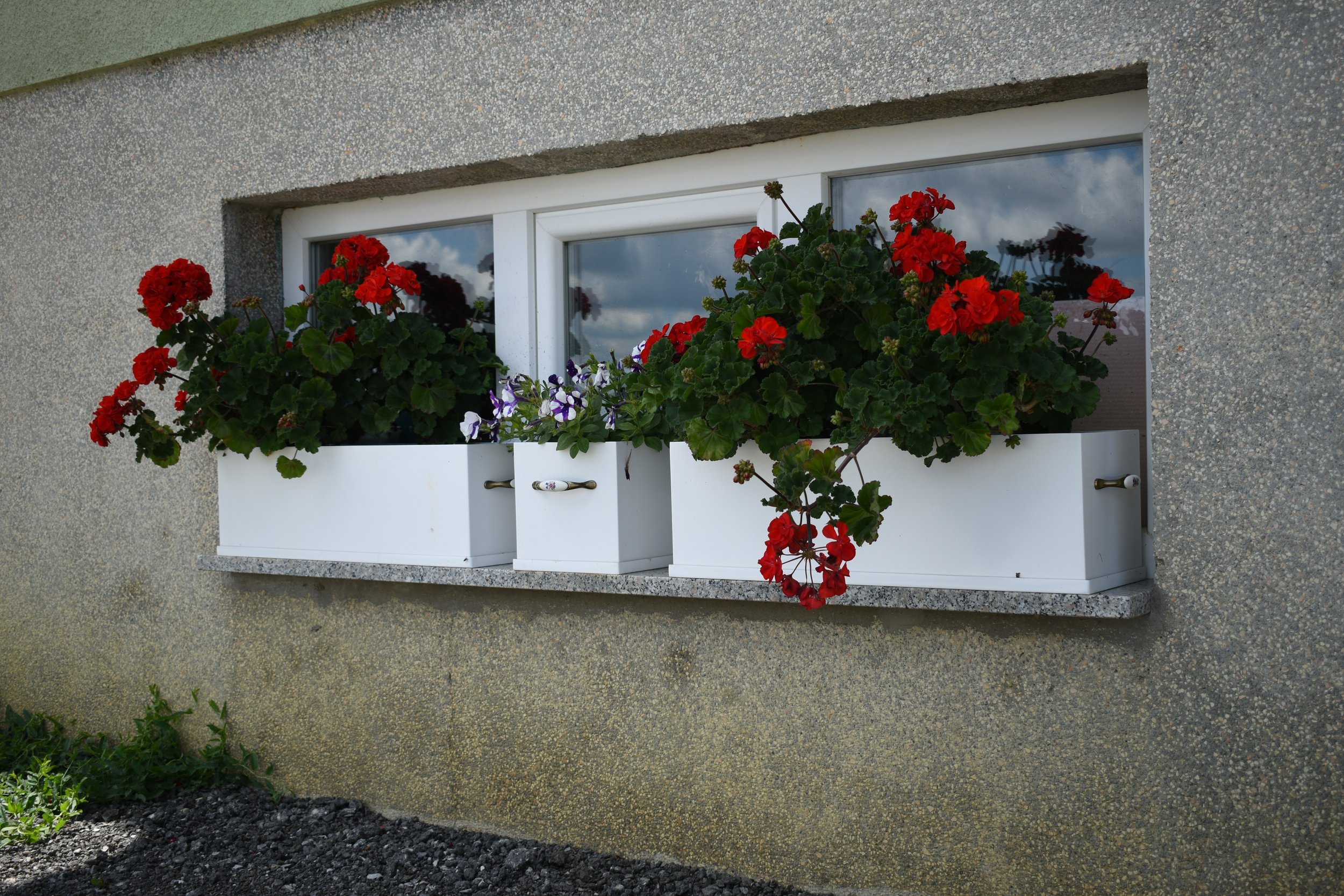 White planters for flowers made from fiberglass composites