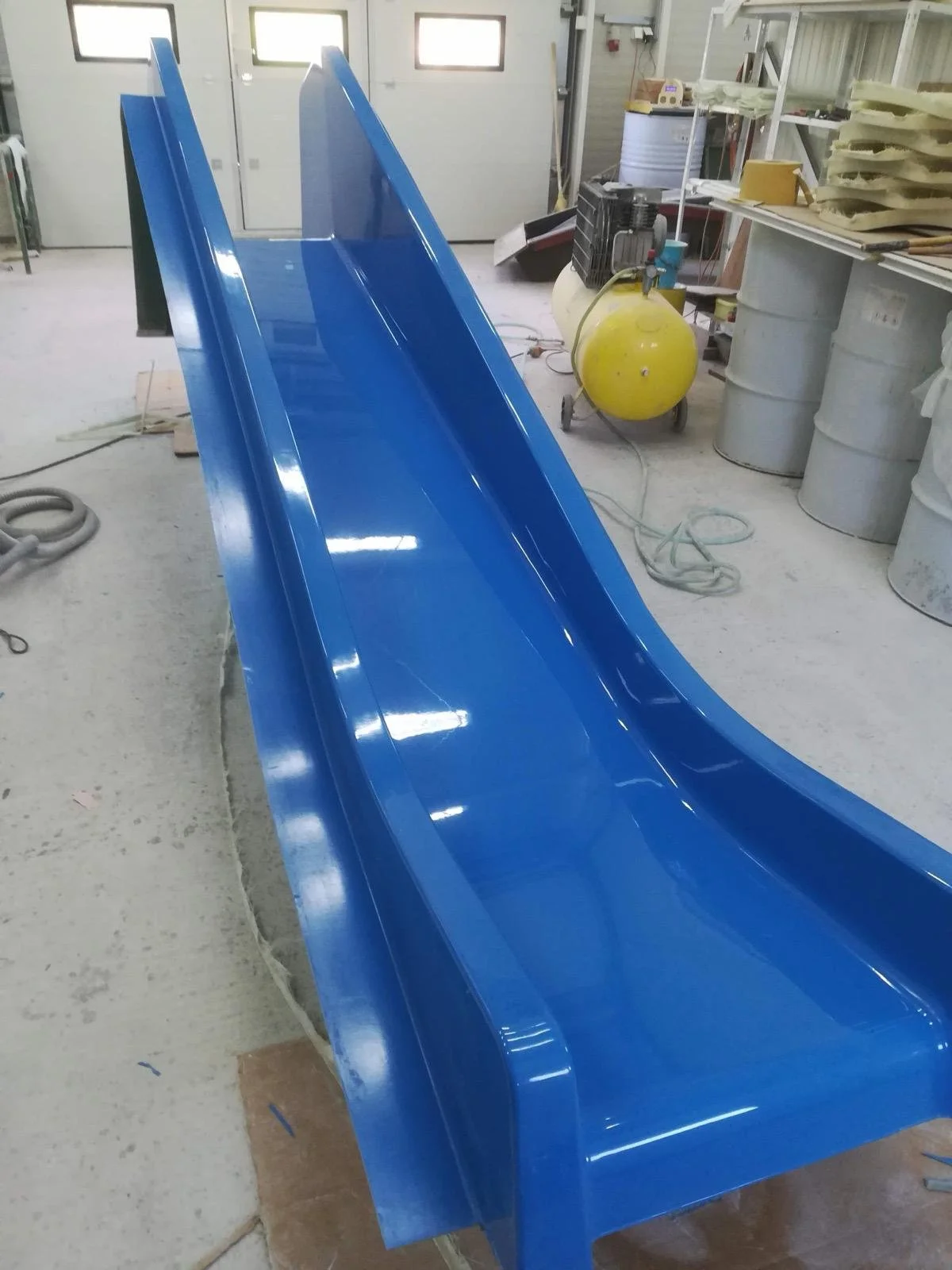 Blue water slide made from fiberglass composites