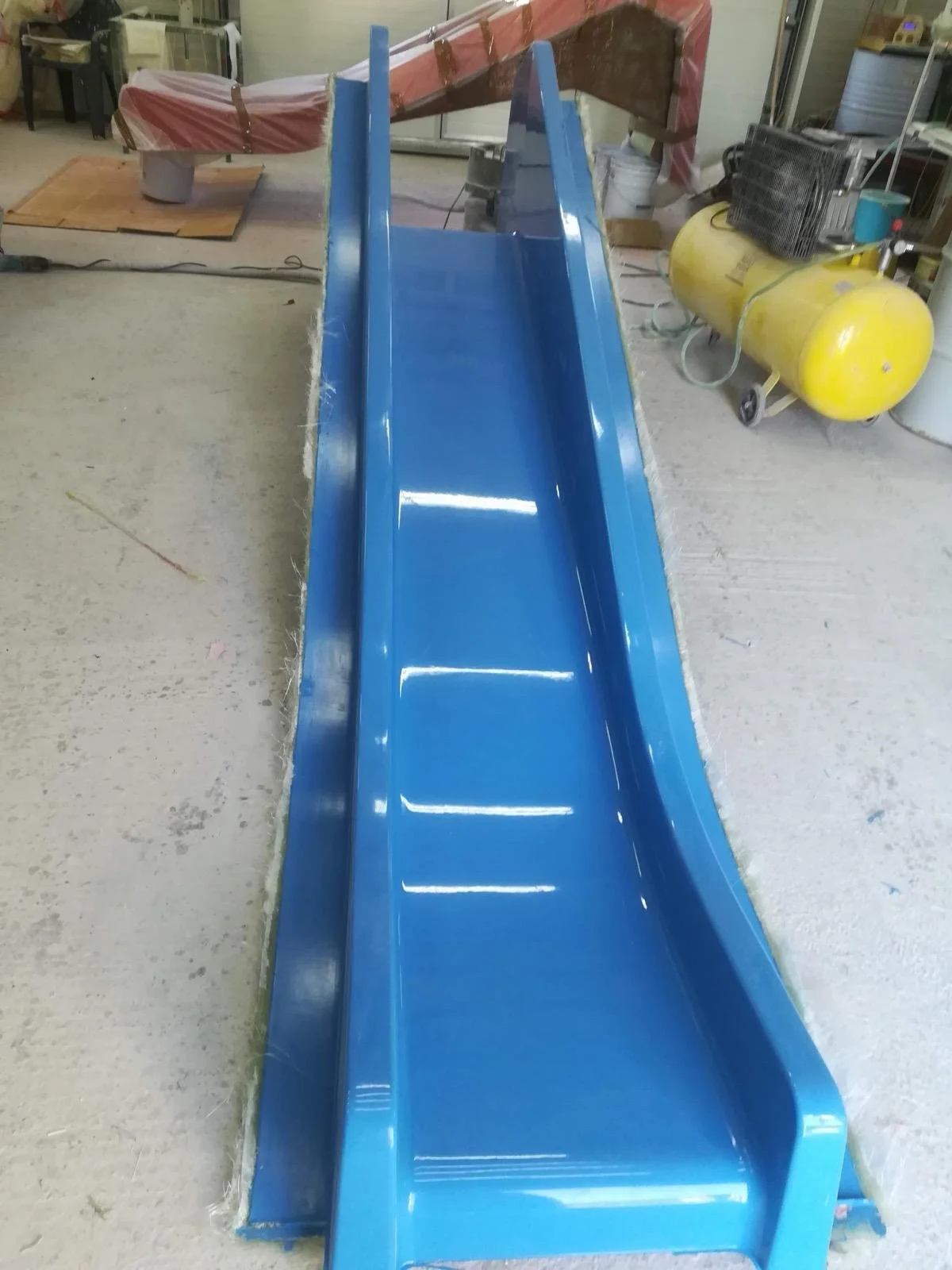 Blue water slide made from fiberglass composites