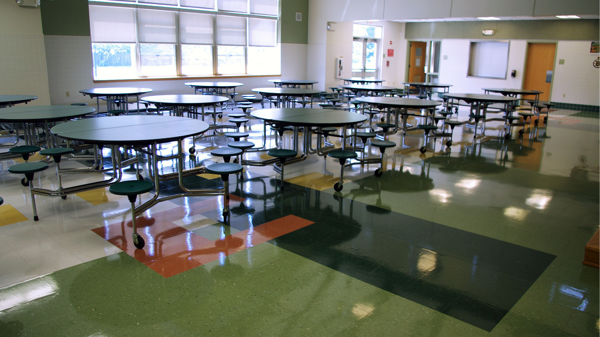 empty school cafeteria with tables