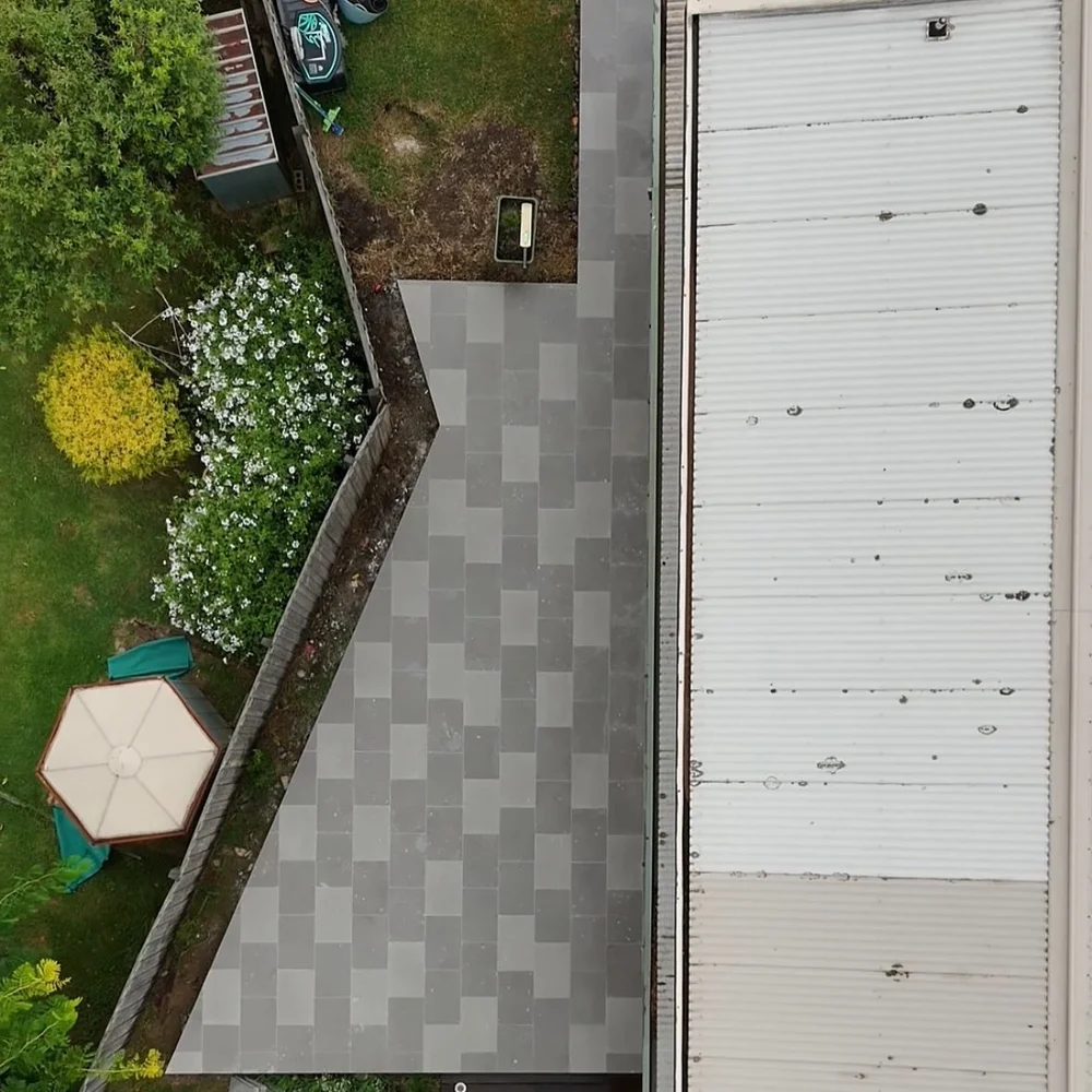 Paved side path and garden edge from above