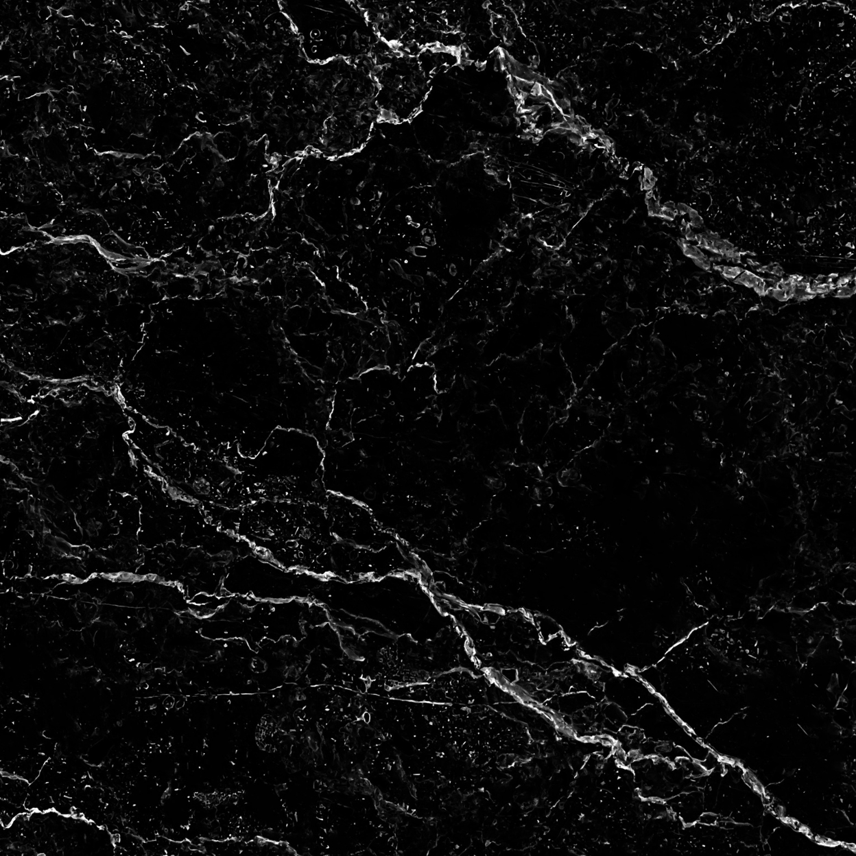 Black marble surface with white veining.