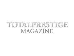 Cover of Total Prestige Magazine with the title in gray and red text.