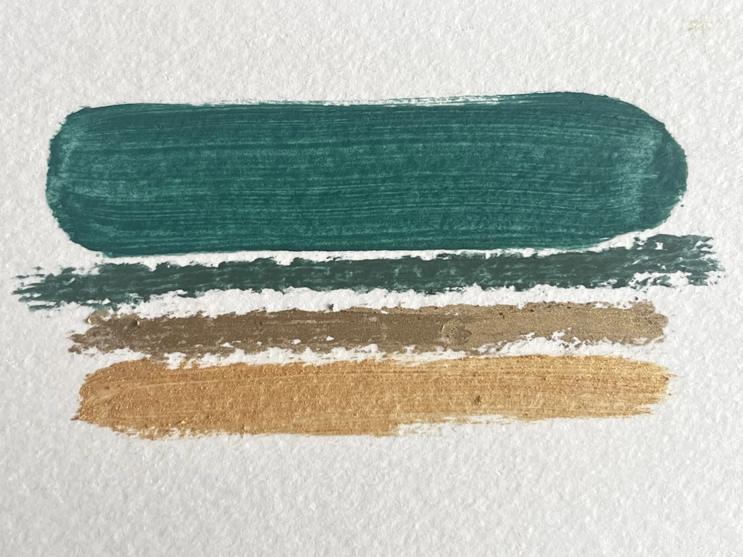 A stack of colour swatches, green oil paint, green oil pastel, gold oil pastel and gold oil paint, reflecting the signature colours of Greyfriars Art Shop.