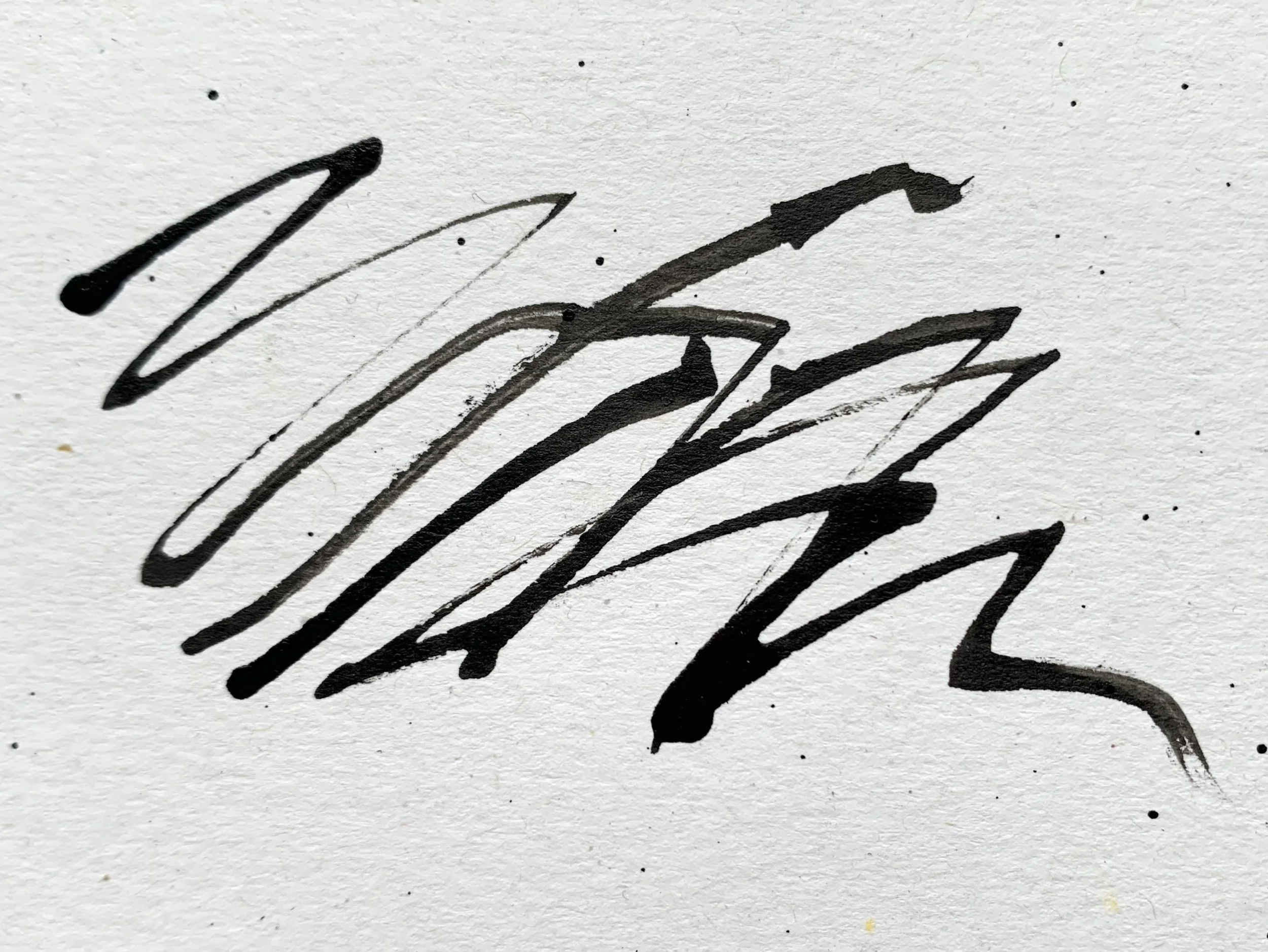 Ink marks on white paper.