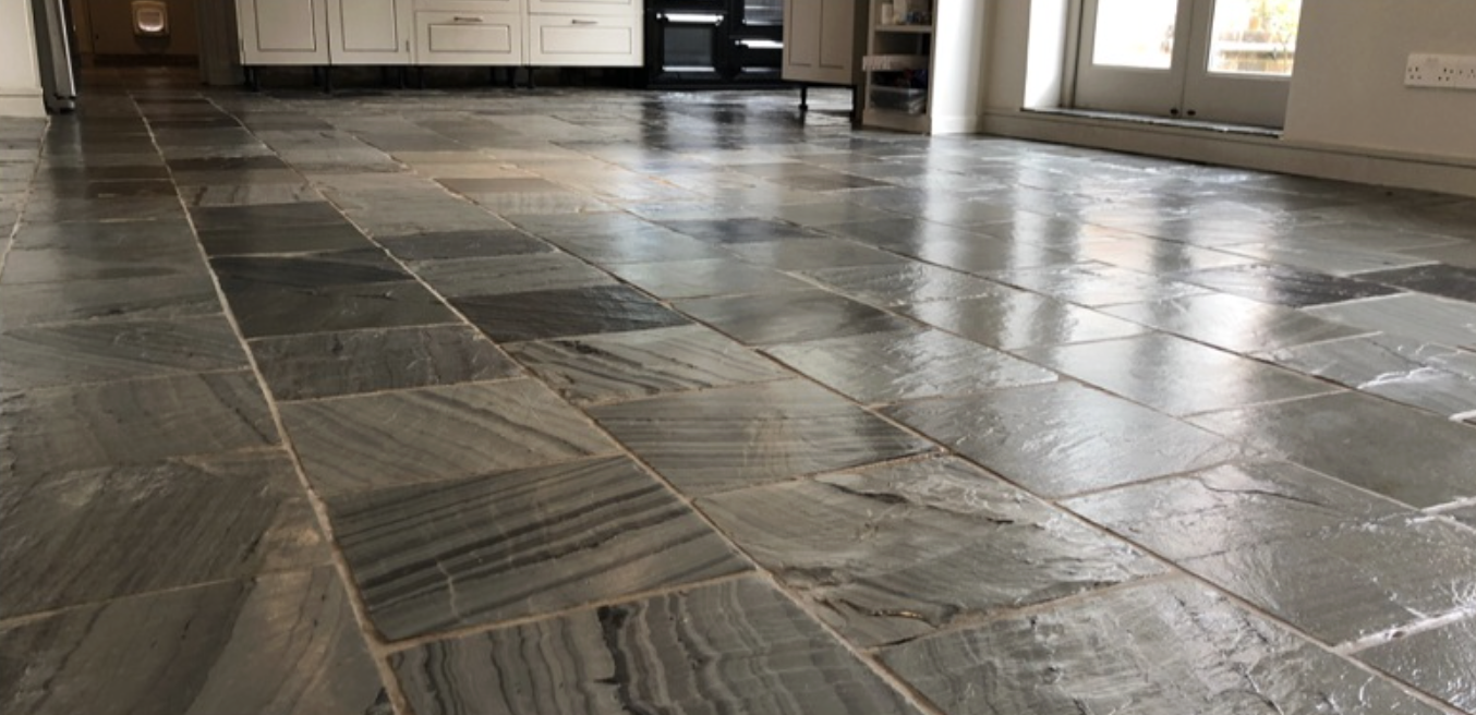 Close-up of slate tile flooring after deep cleaning and sealing.