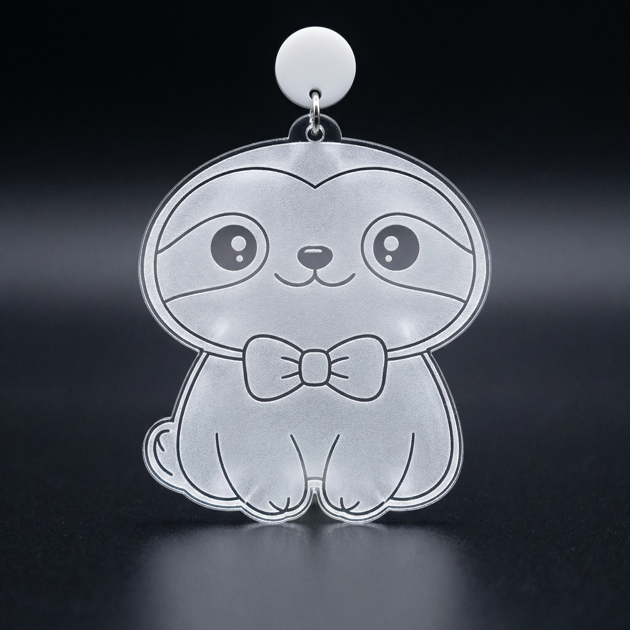 006_A_clear_acrylic_sloth_charm_is_suspended_against_FBNSNIT3.png
