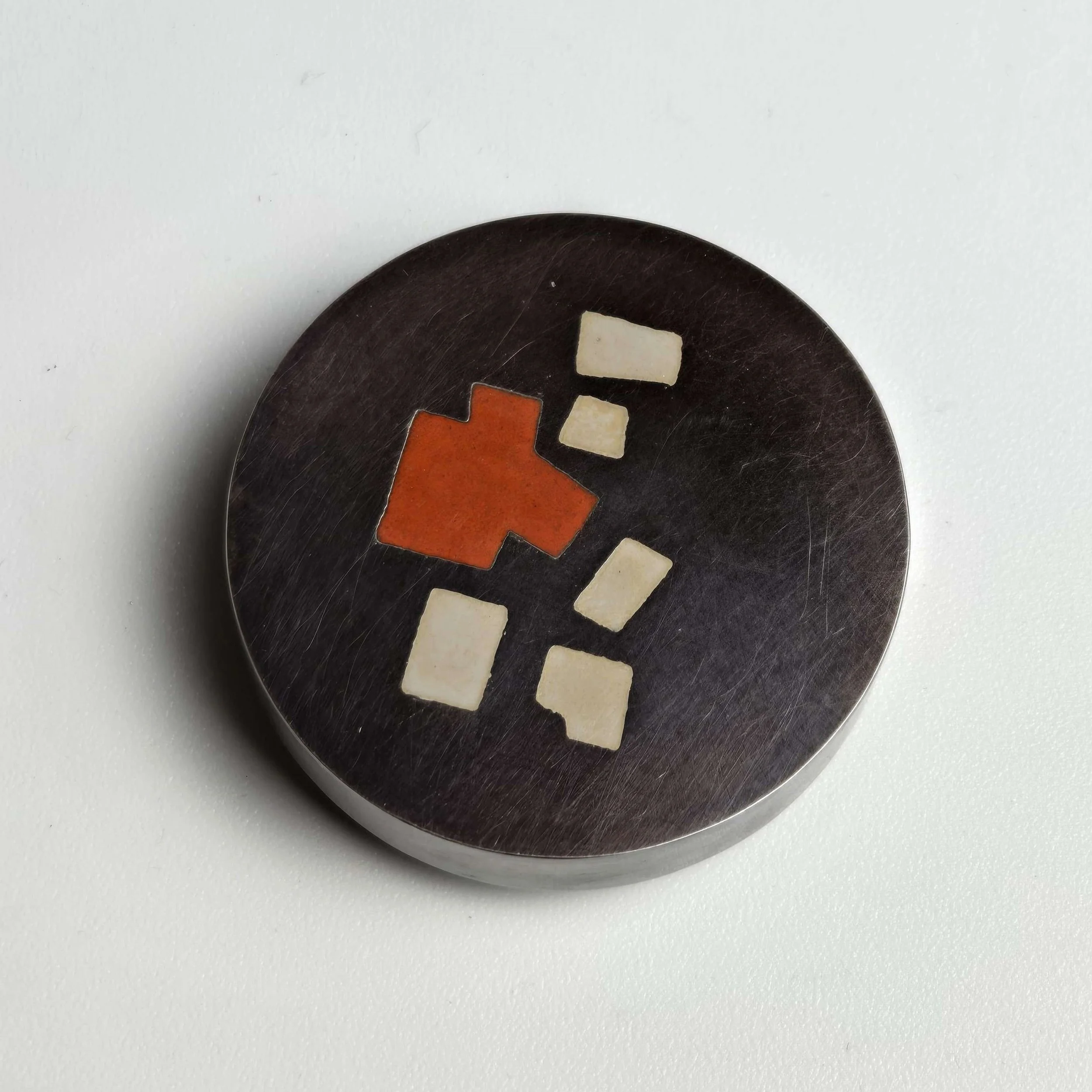 enamelled brooch