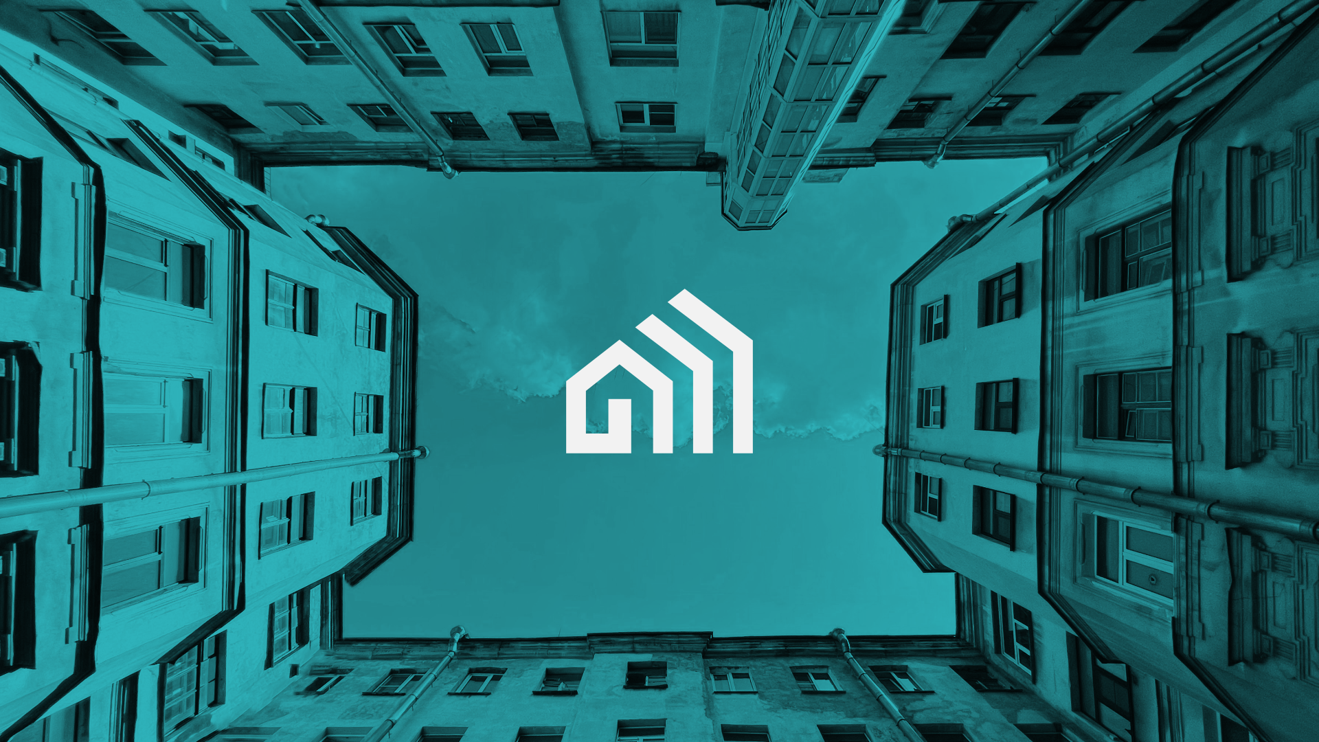Looking up at four tall buildings with a logo in the center of the sky area.