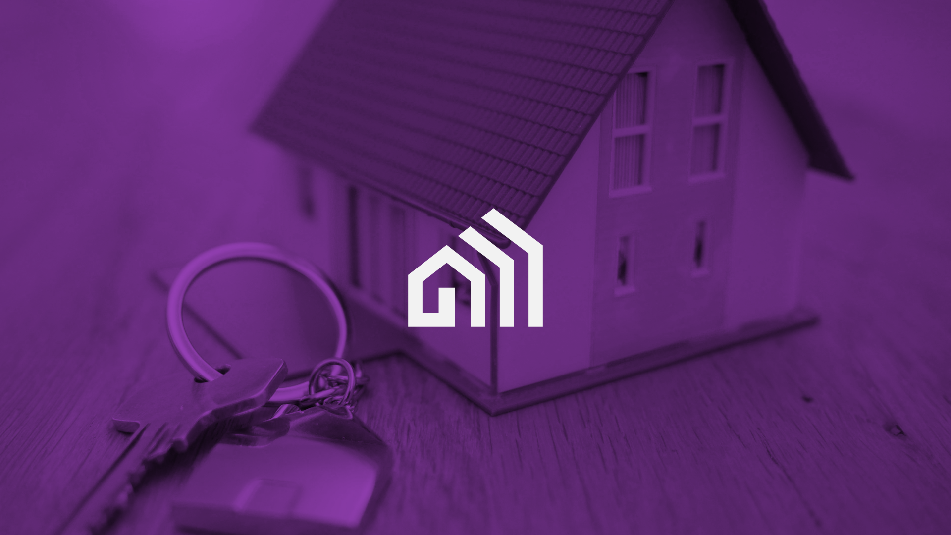 A miniature model of a house with a set of house keys and keychain on a wooden surface, all with a purple tint.