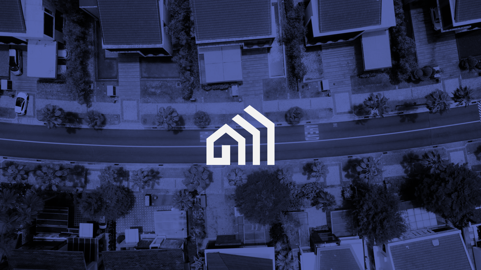 An aerial view of a residential neighborhood with houses, trees, and parked cars, depicted in monochrome blue tones, with a white logo in the center featuring a stylized house and three ascending bars.