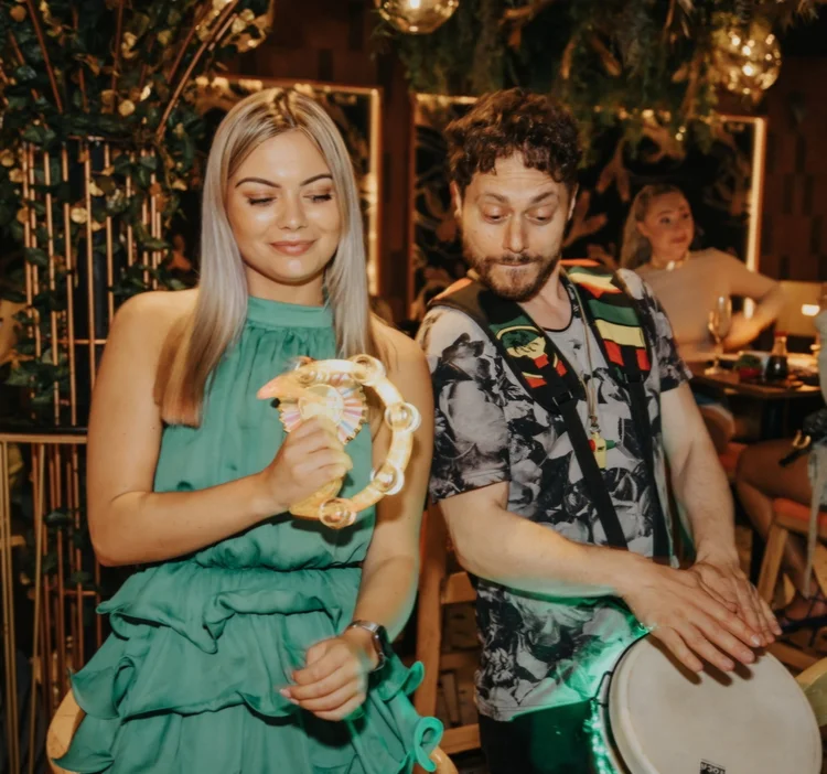 Guest playing tambourine