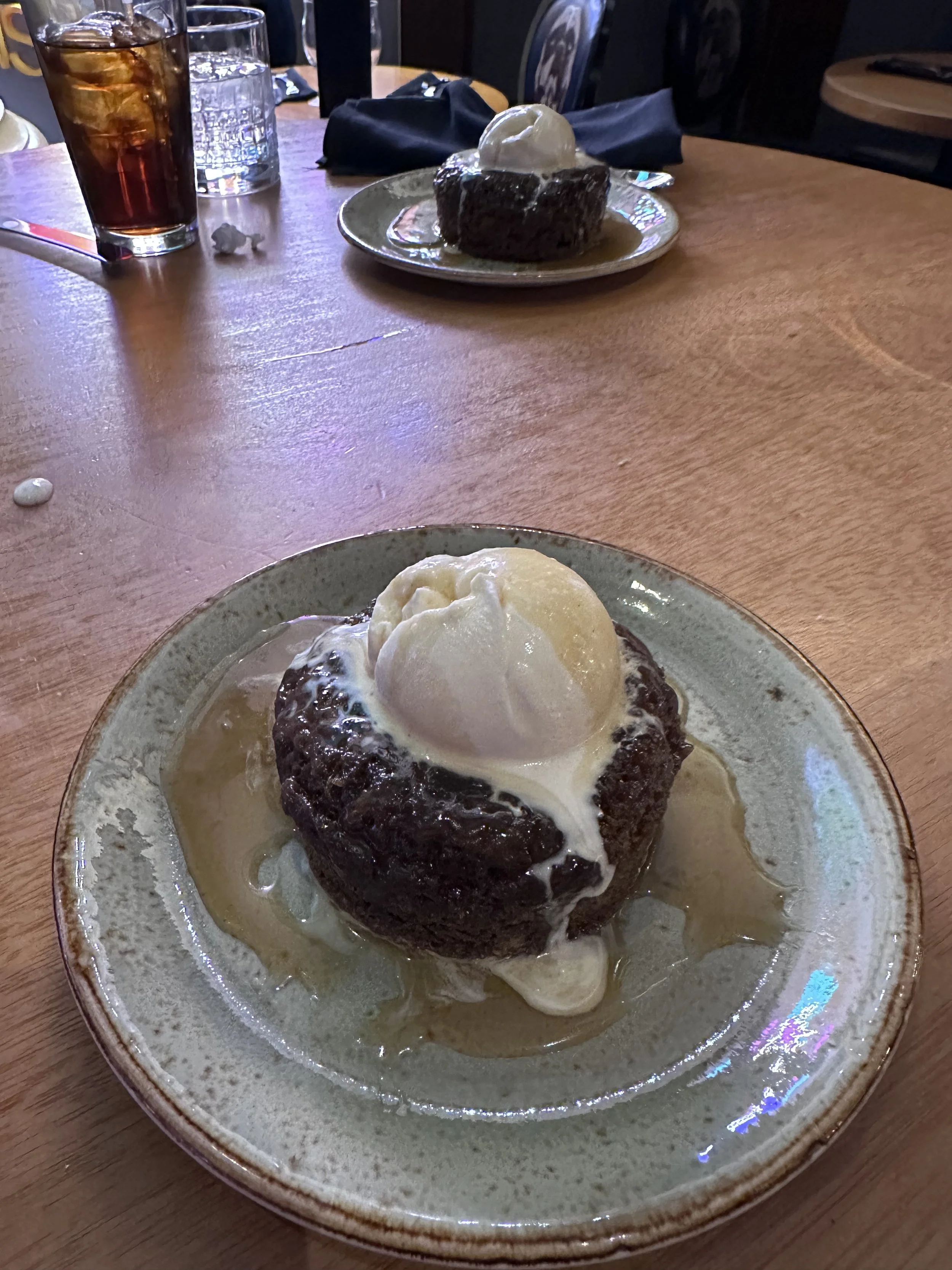 Sticky toffee pudding topped with melting vanilla ice cream and caramel sauce at Gordon Ramsay Pub & Grill Las Vegas.