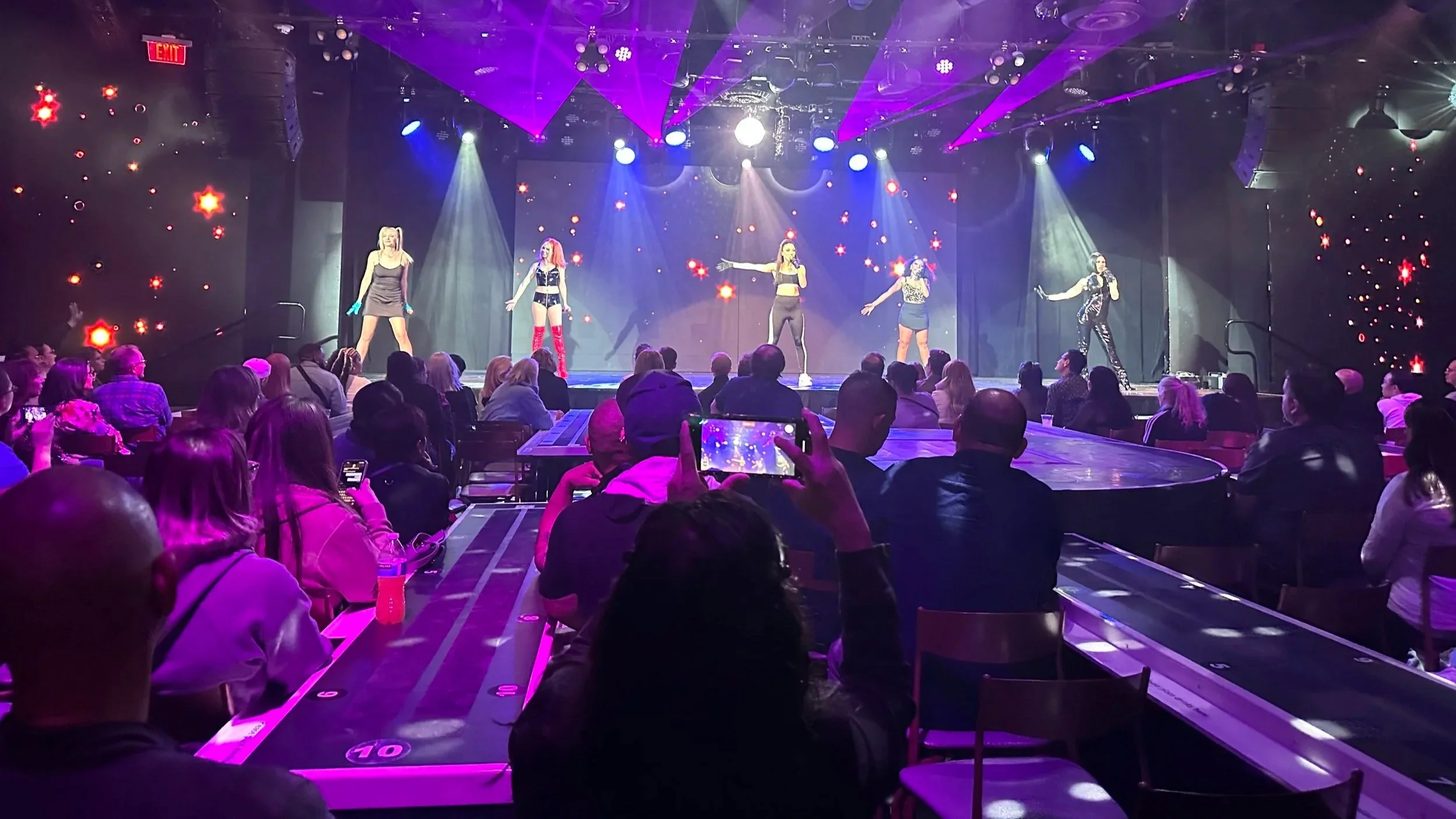 Spice Girls tribute band performing on stage at the Excalibur Hotel and Casino in Las Vegas.