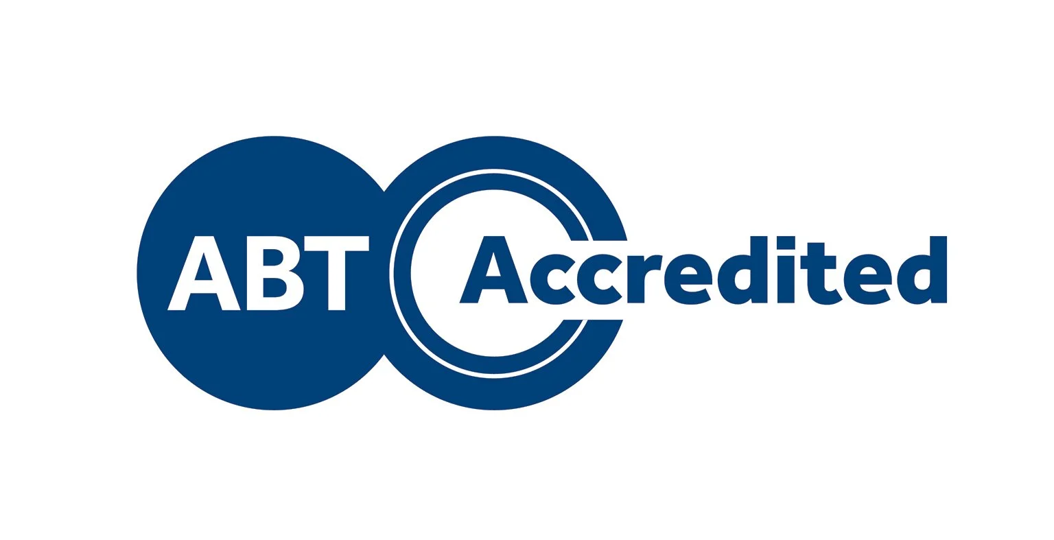 ABT Accredited logo with blue circles and text.