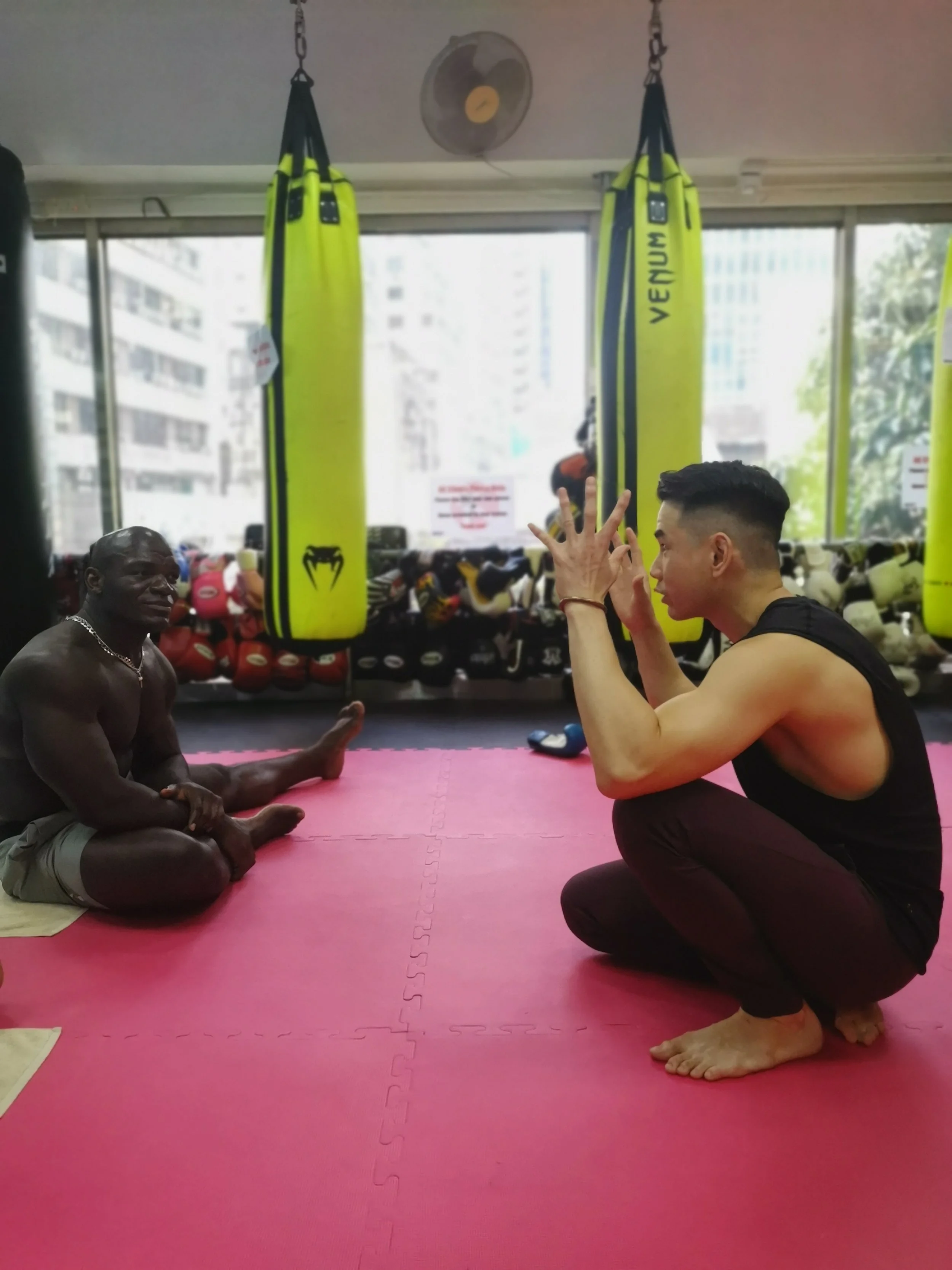 
Brian guiding world champion martial artist Alain Ngalani (ONE FC)