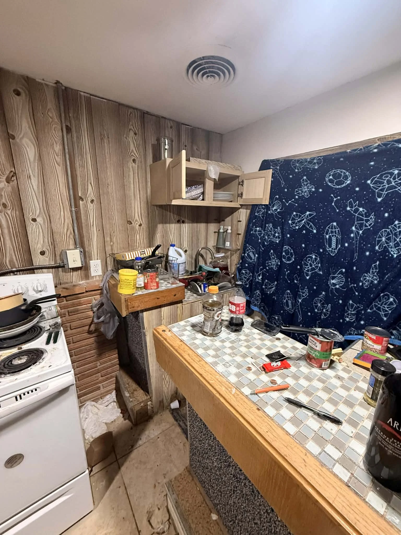 Interior cleanout in progress showing removal of debris, materials, and unwanted items from a residential space.