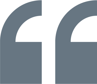 Two large, stylized quotation mark icons, one on each side of the image.