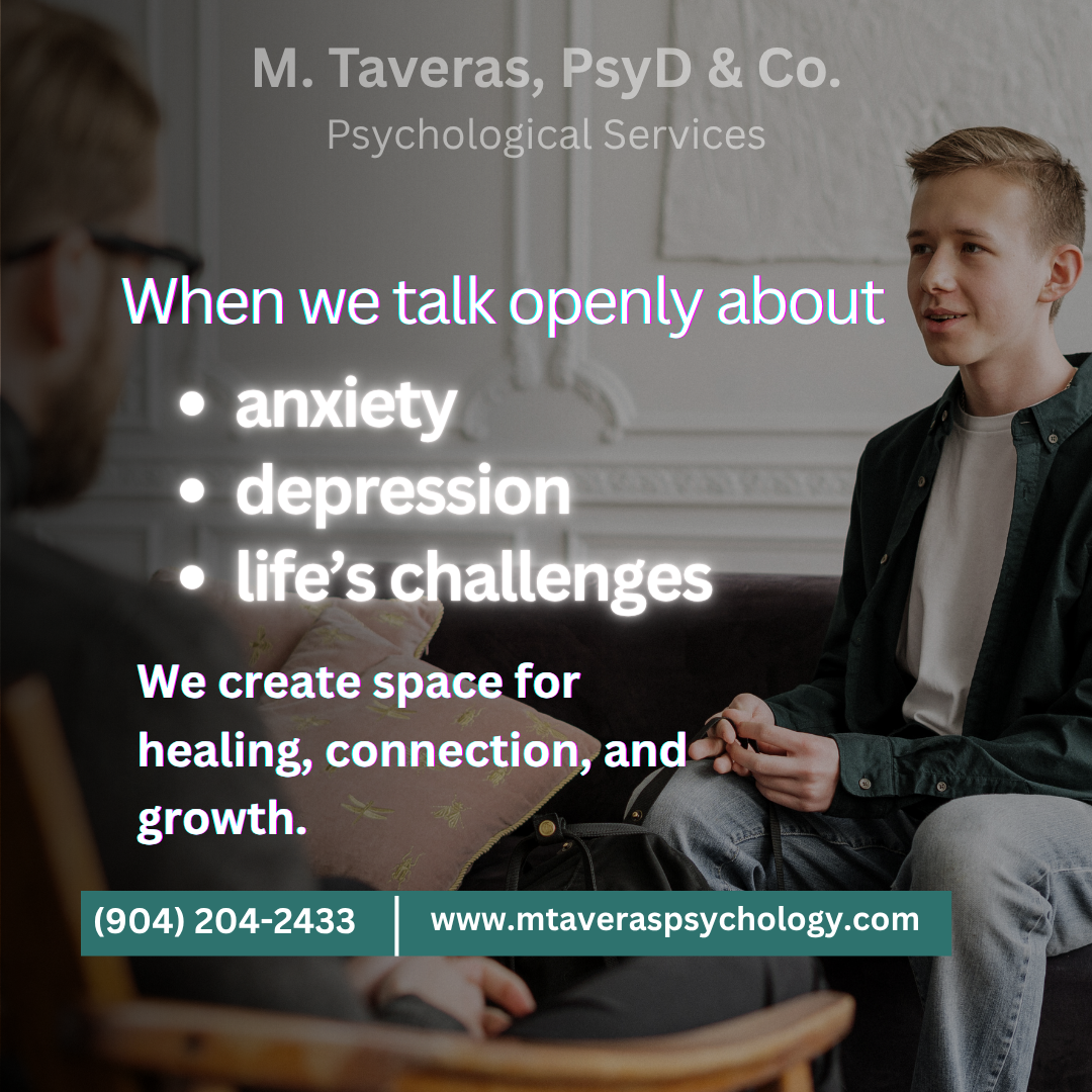 psychologist and young man in counseling session at therapy office.