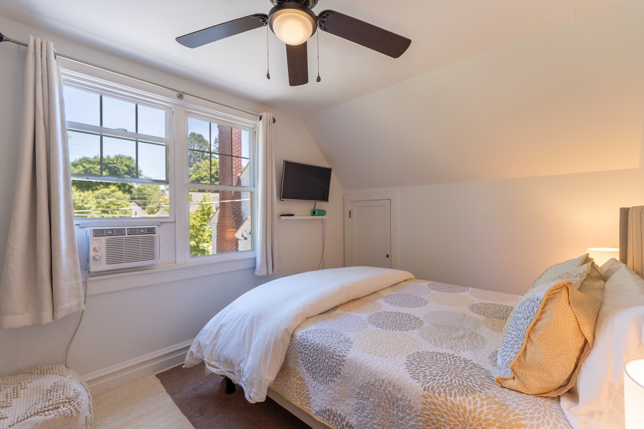 Queen bed in Cloud 9 Loft Apartment at New River Nooks in Fayetteville, WV.