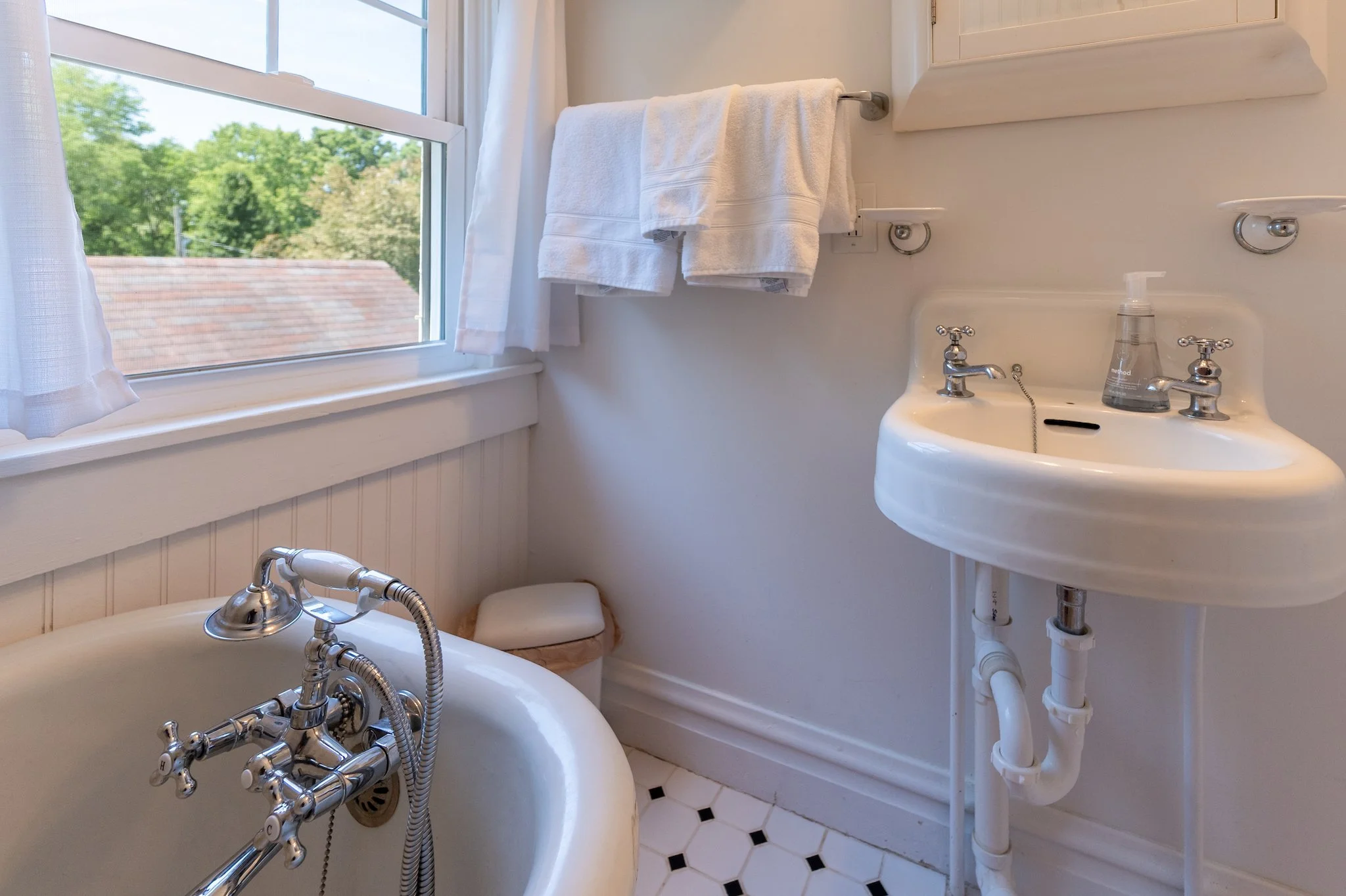 Cloud 9 Loft Apartment bathroom featuring clawfoot bathtub in Fayetteville, WV.