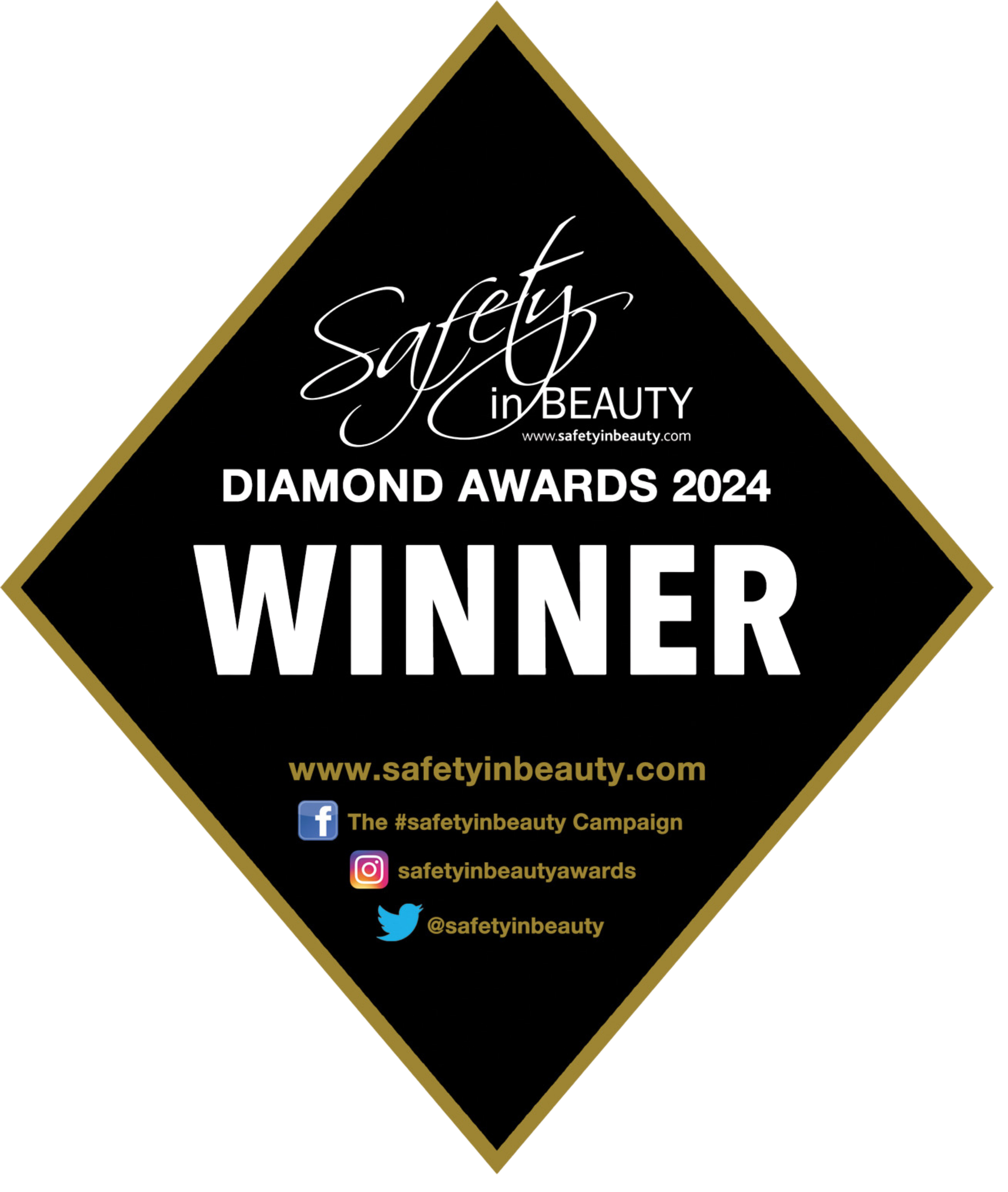 Black diamond-shaped award badge with gold border, featuring the text 'Safety in Beauty' at the top, 'DIAMOND AWARDS 2024' in the middle, and social media icons with handles at the bottom.