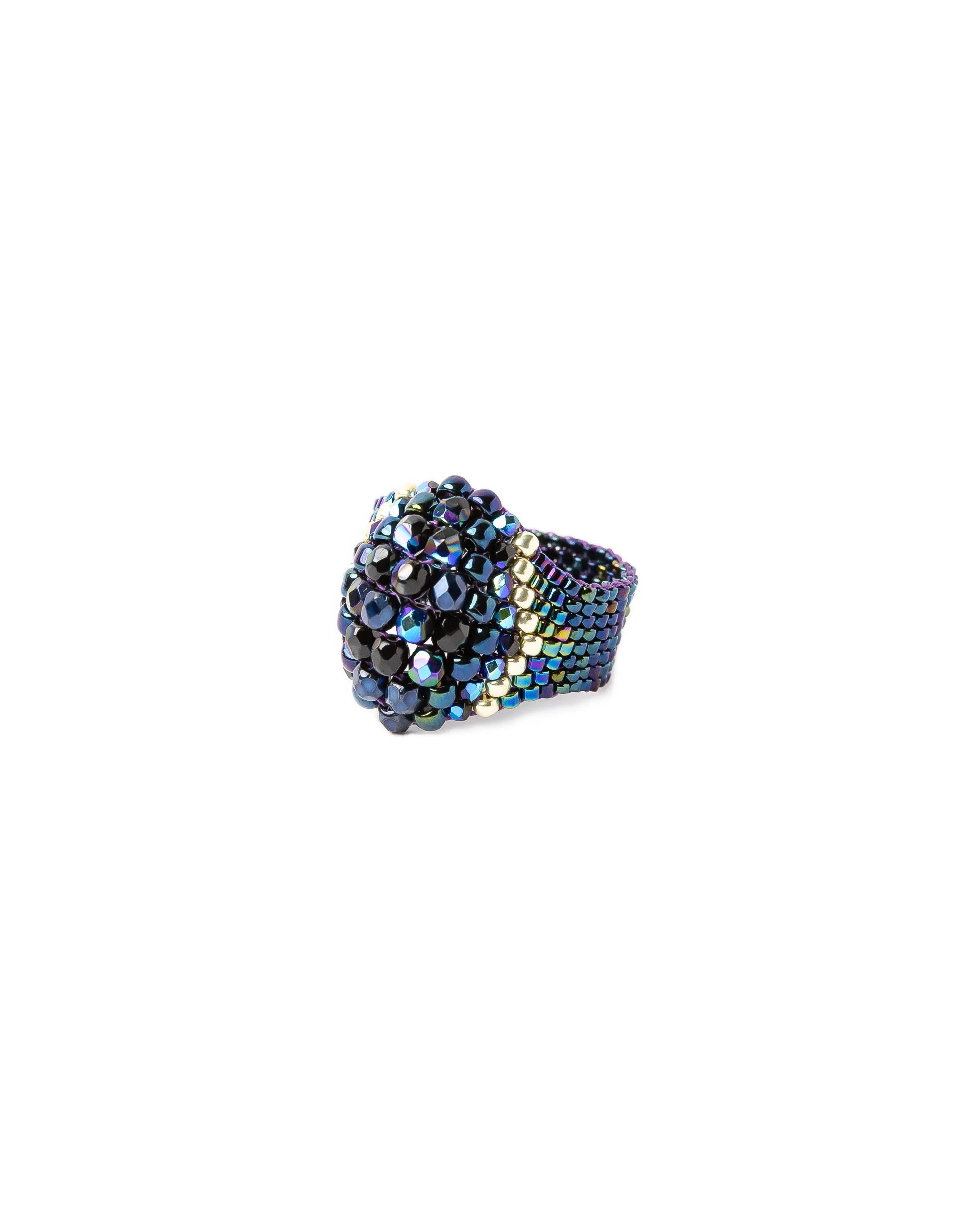 Blue statement ring photographed at an angle on a white background for e-commerce jewellery brand