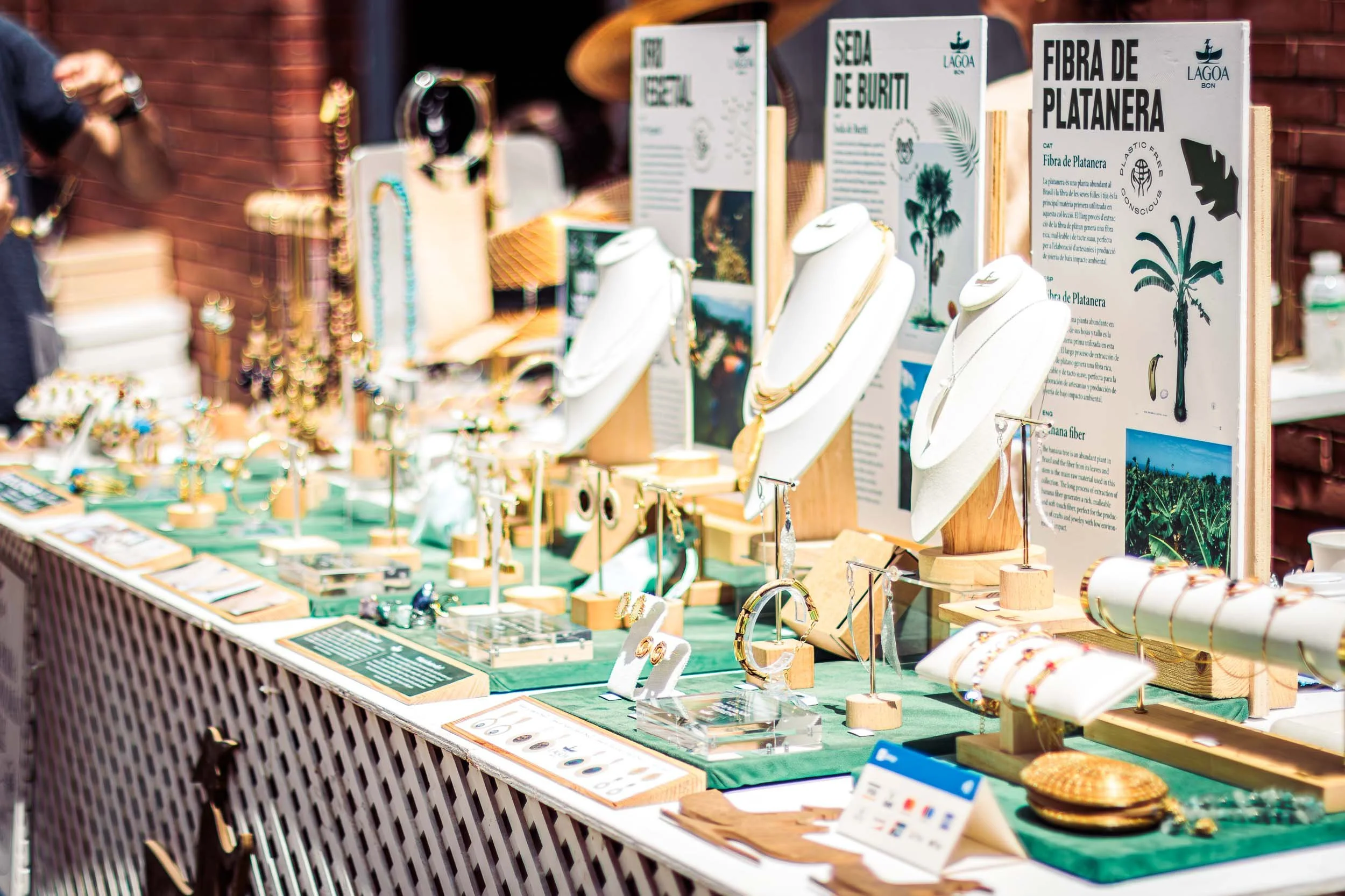 Close-up of a jewellery display stand with accessories arranged on a table