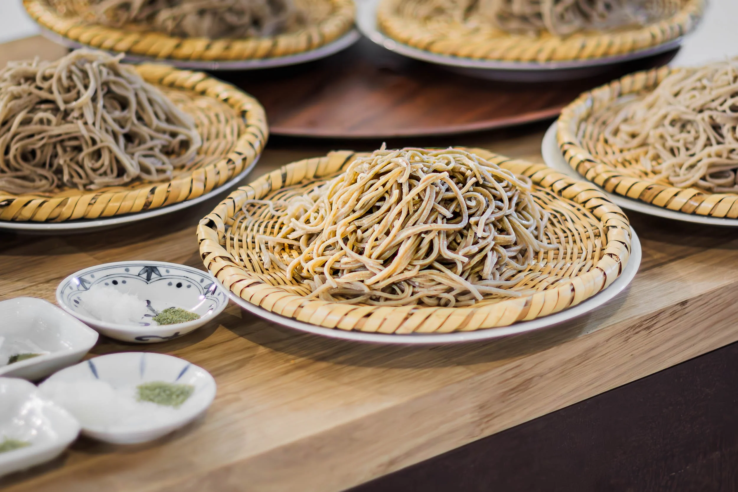Multiple trays of soba noodles prepared for service at Japanese cuisine Barcelona restaurant