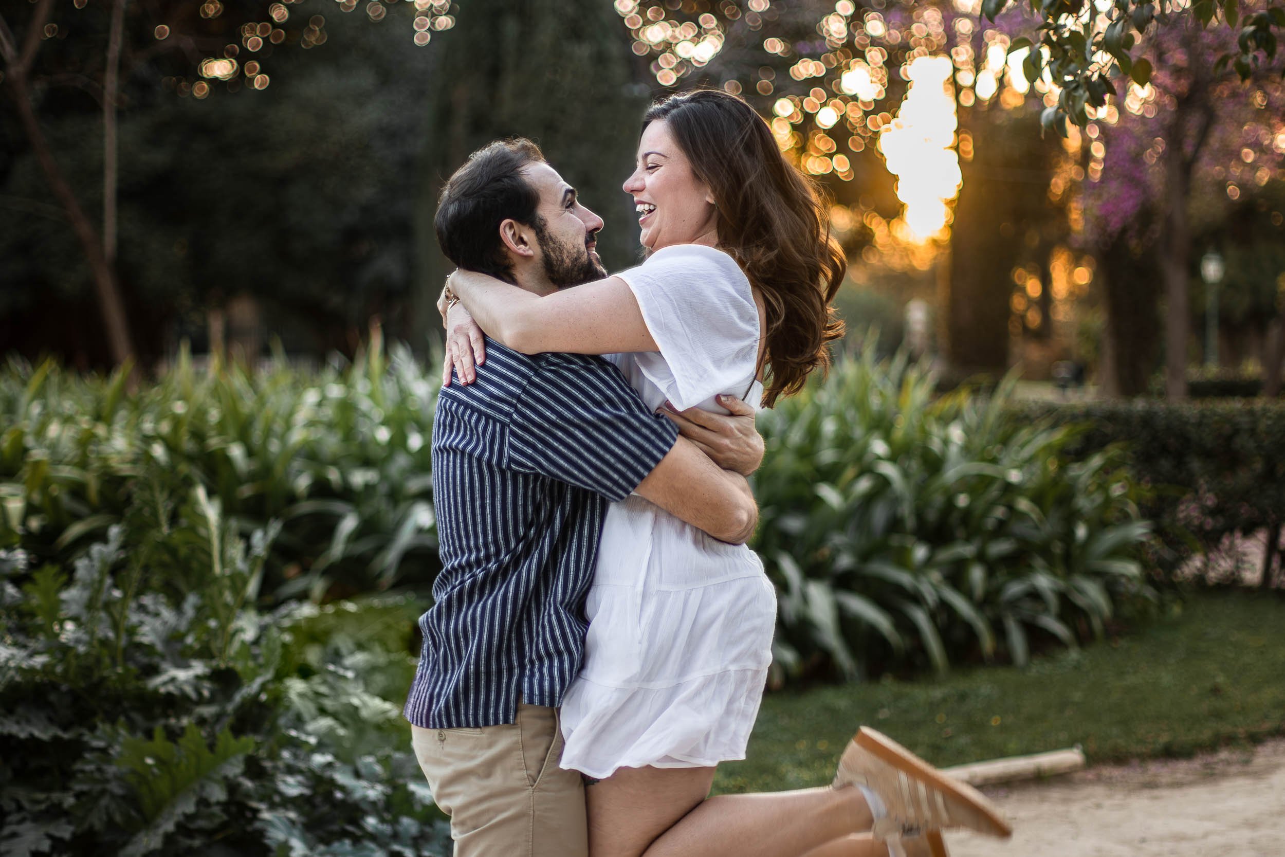 Portrait of a couple embracing in a garden during golden hour
