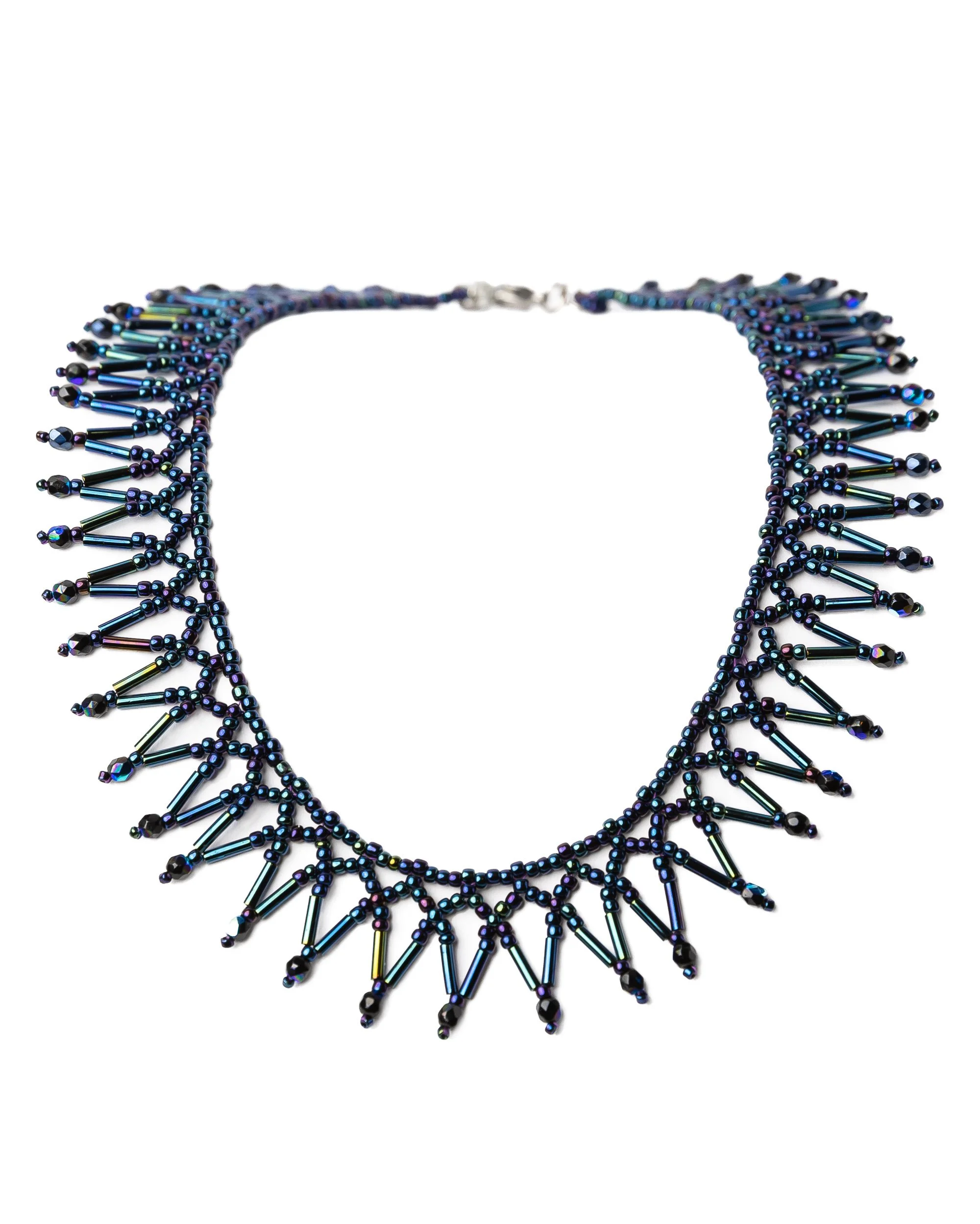 Blue beaded necklace with pointed detailing photographed on a white background for a jewellery brand in Barcelona