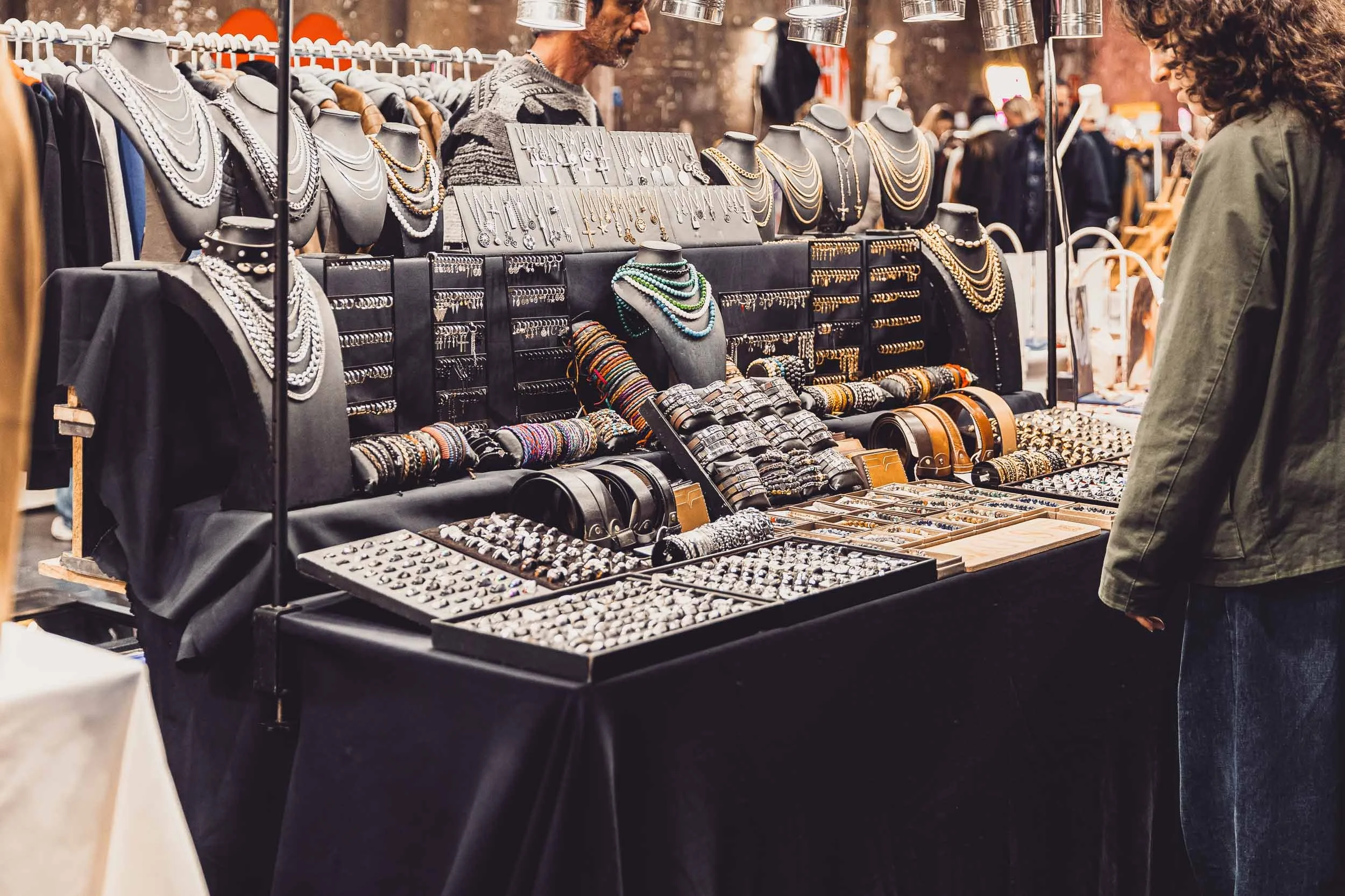 Close-up of a vendor display with jewellery and accessories at a market event