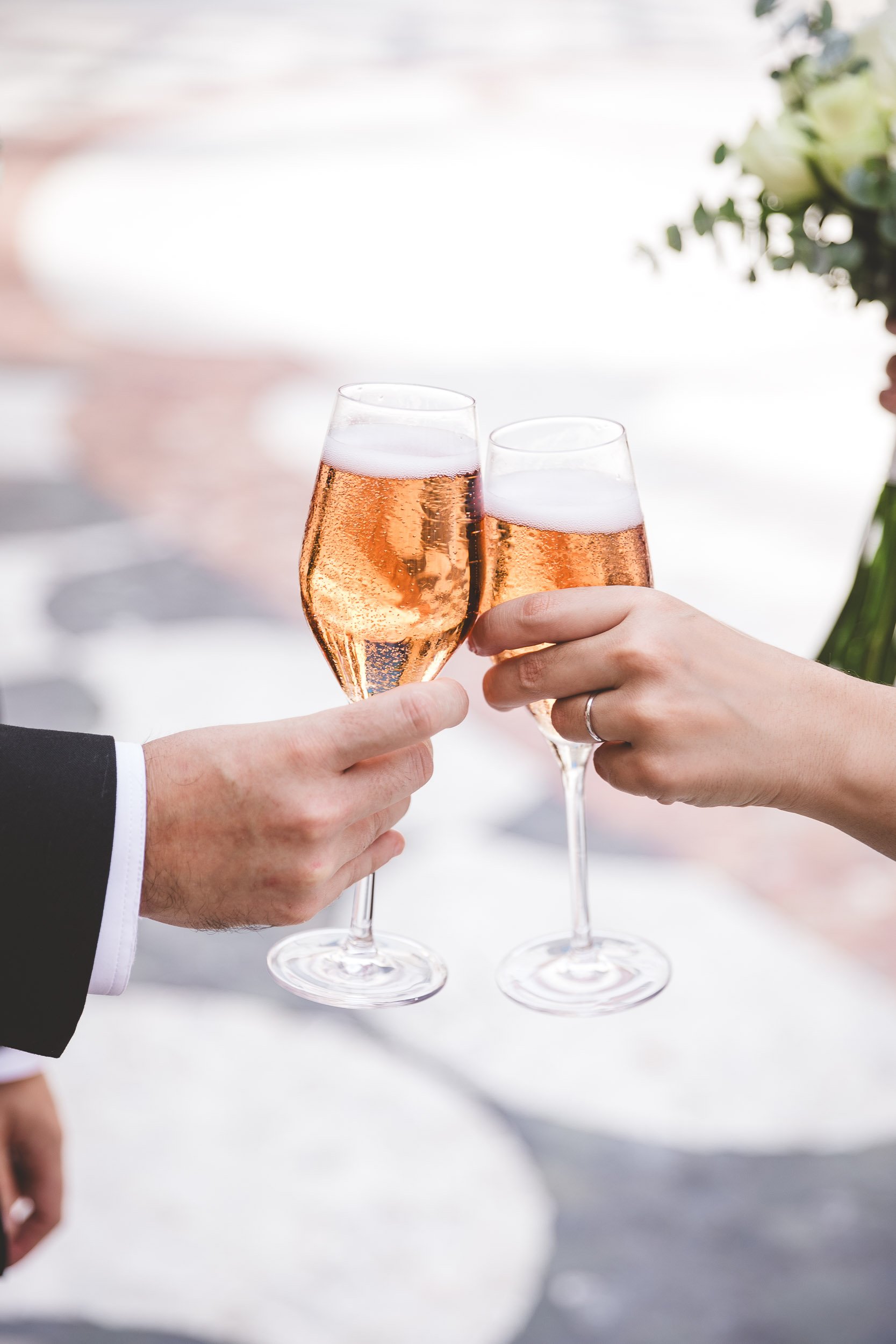 Bride and groom toasting with glasses after the ceremony