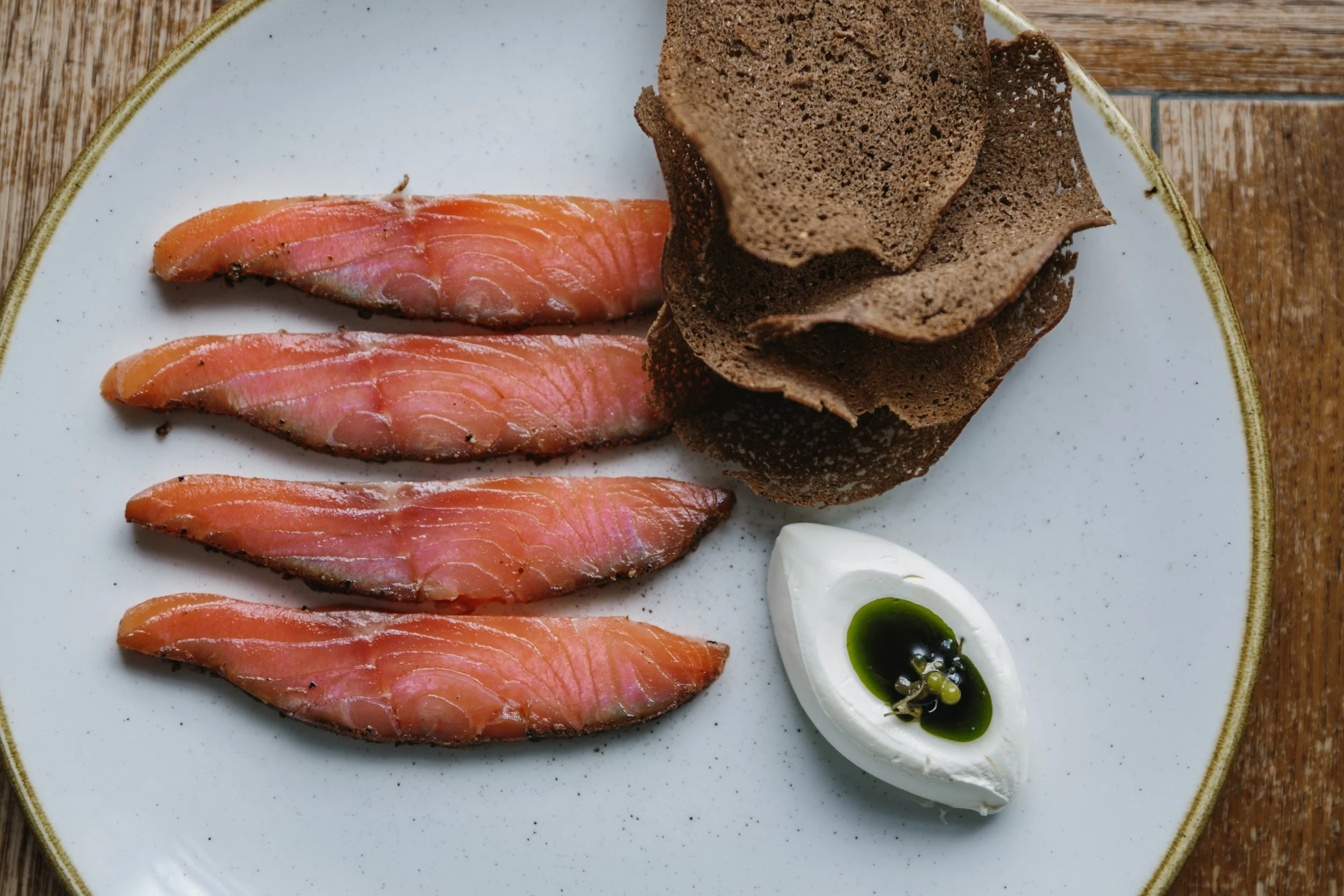 trout pastrami, creme fraiche and rye crispbreads