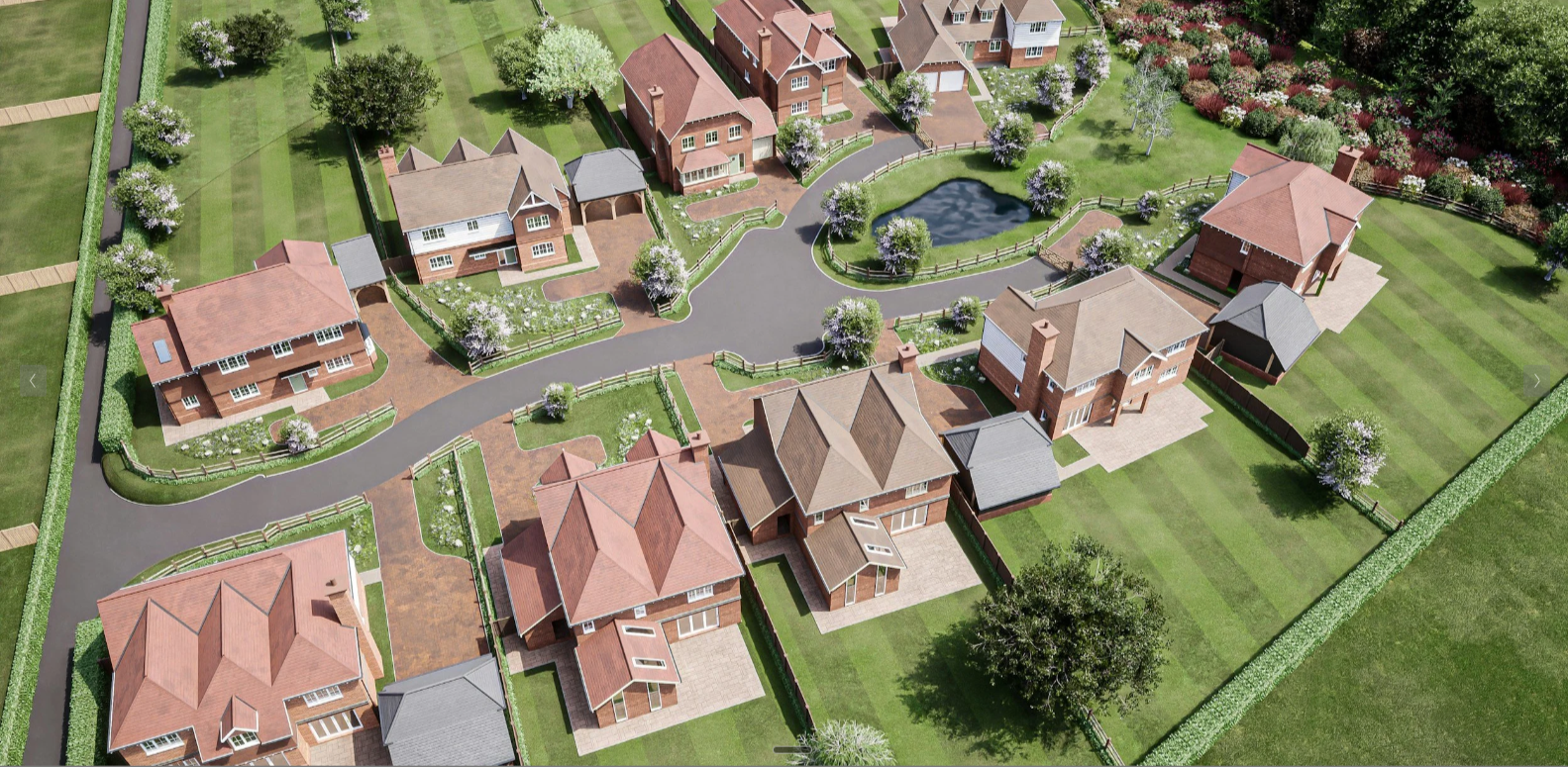 Aerial view of a residential neighborhood with multiple houses, trees, a small pond, paved roads, and green lawns.