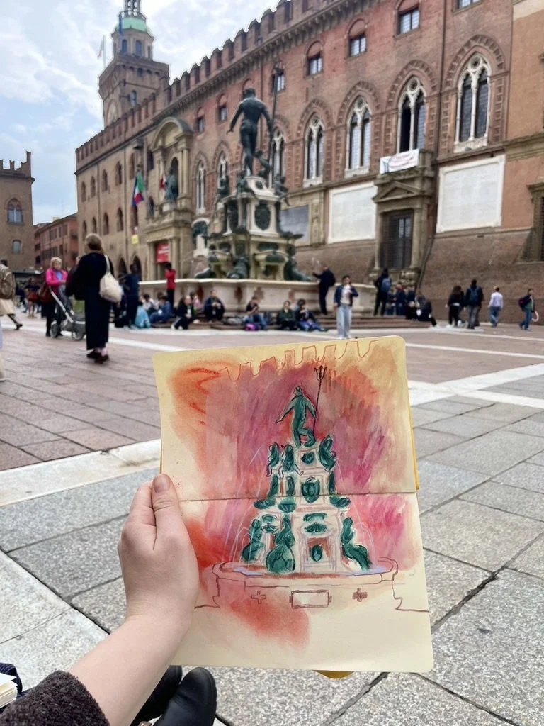 Drawing of a fountain with a statue of a person holding a trident on top, held by a person in front of an historic building with a clock tower and statues, in a crowded city square.