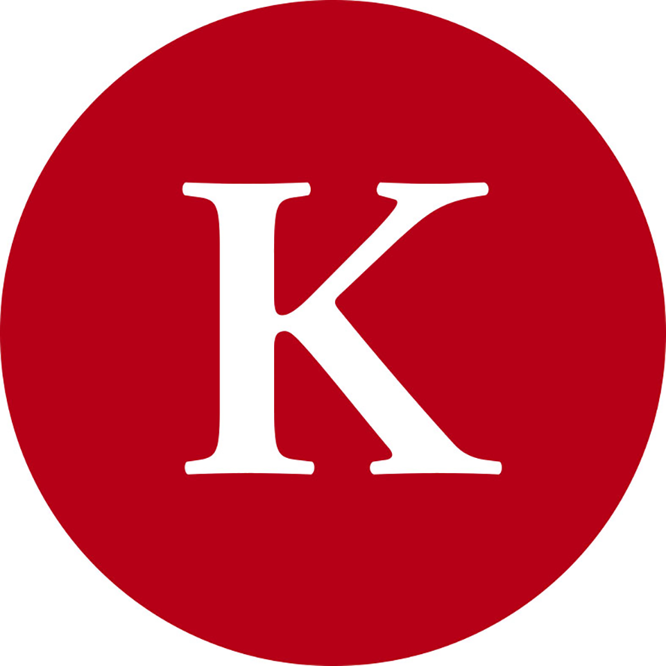 Ein roter Kreis mit einem weißen Buchstaben 'K' in der Mitte.