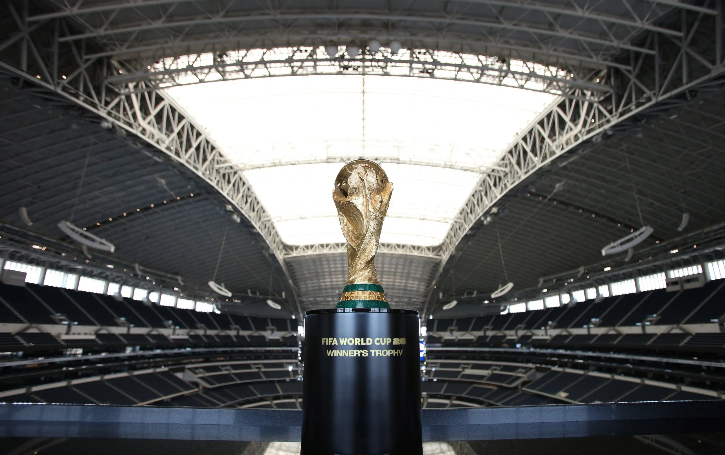 Trophy shown with Dallas Stadium in background