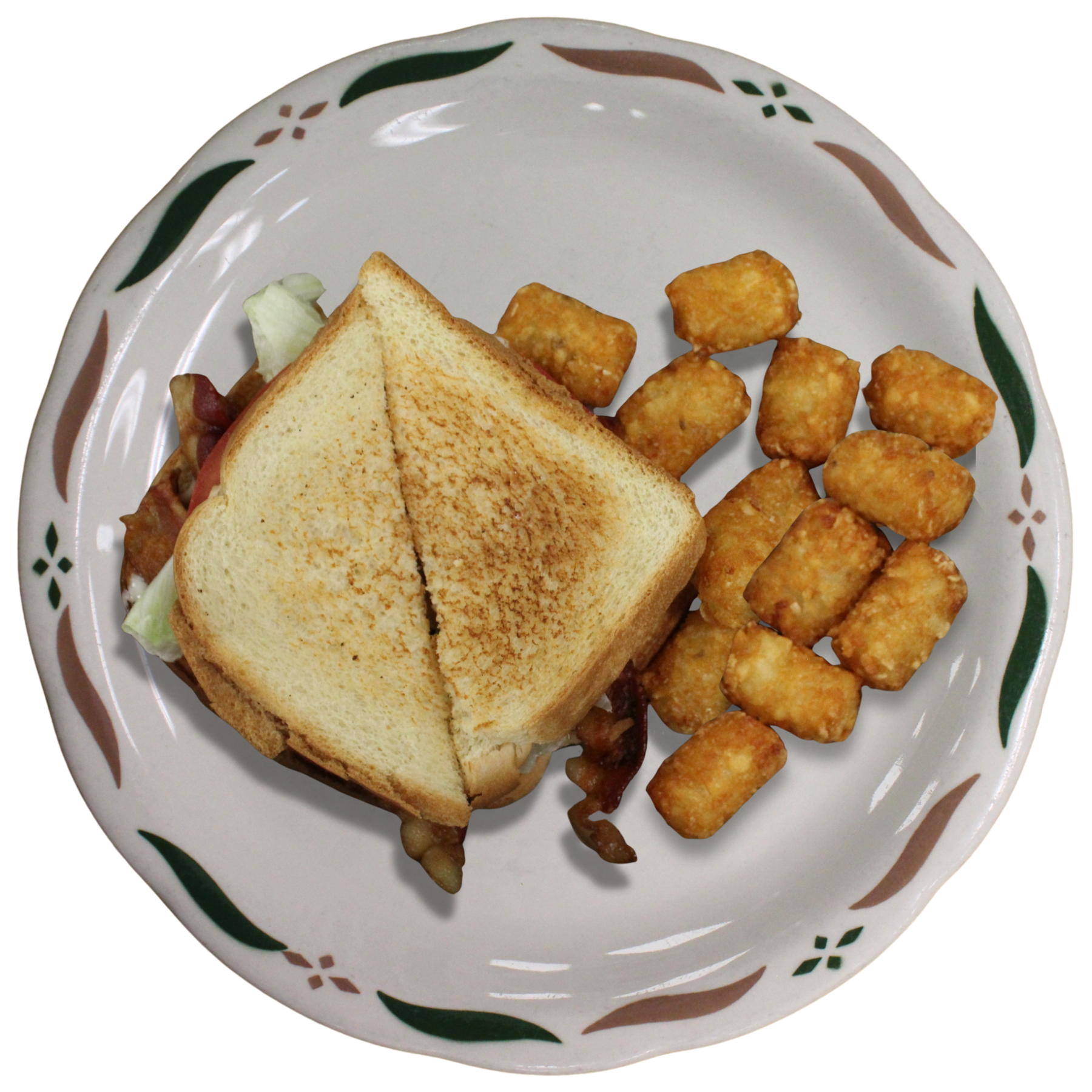 A  plate with a BLT sandwich, tater tots, and some lettuce at Sweet-T-Cafe in West Jefferson, NC.