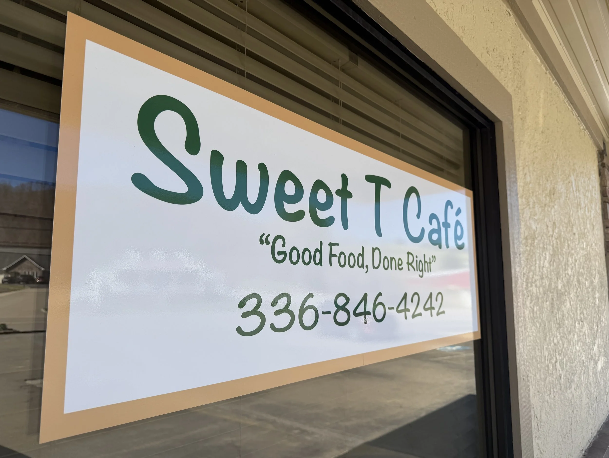 Sign for Sweet T Café with the tagline 'Good Food, Done Right' and phone number 336-846-4242.