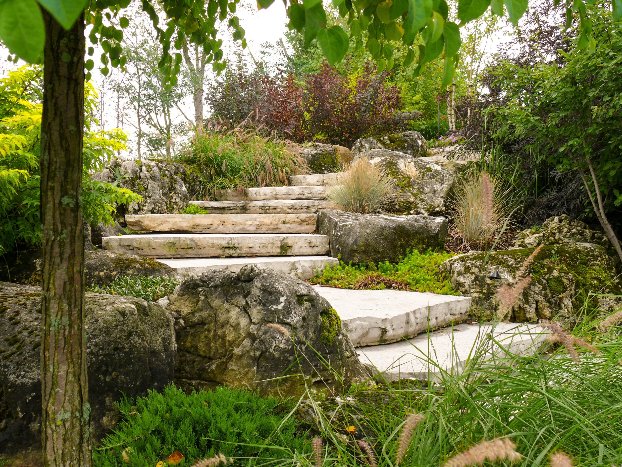 Limestone steps leading you through lush gardens