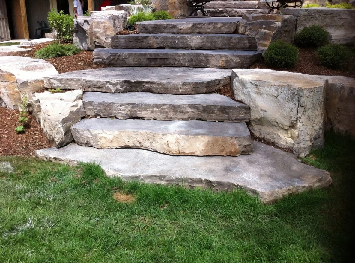 cubical armourstone pieces hugging natural limestone steps