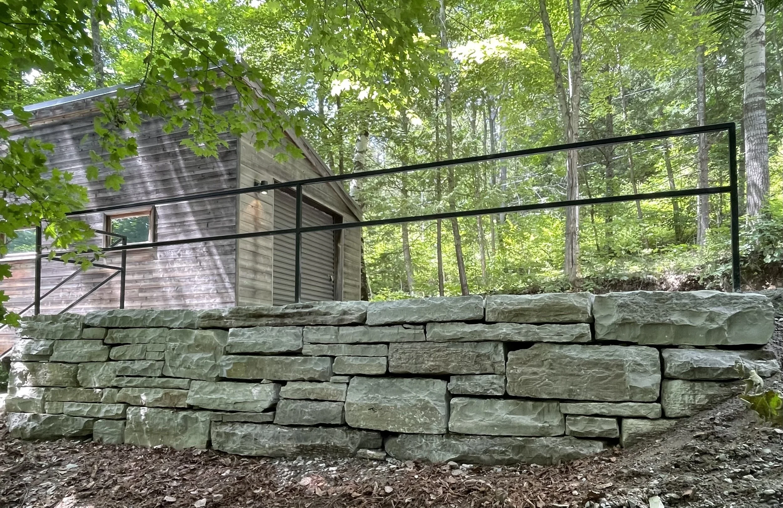 new driveway retaining walls made with armourstone and steps