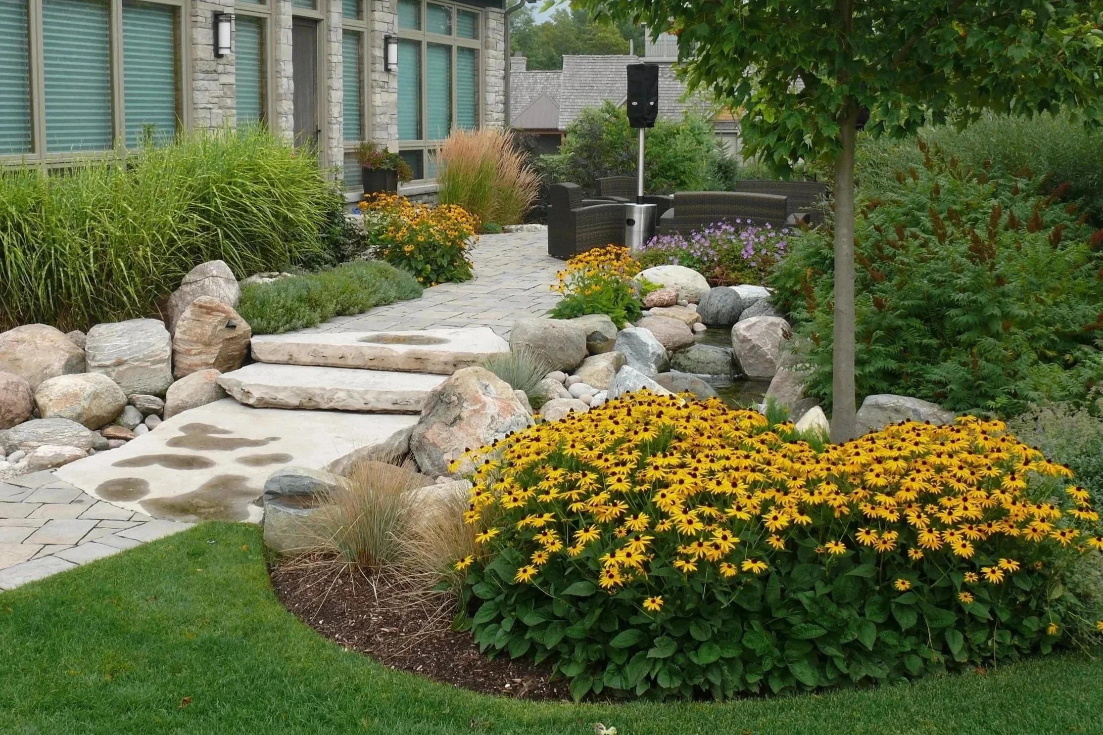 Natural stone steps & bridge over flowing stream