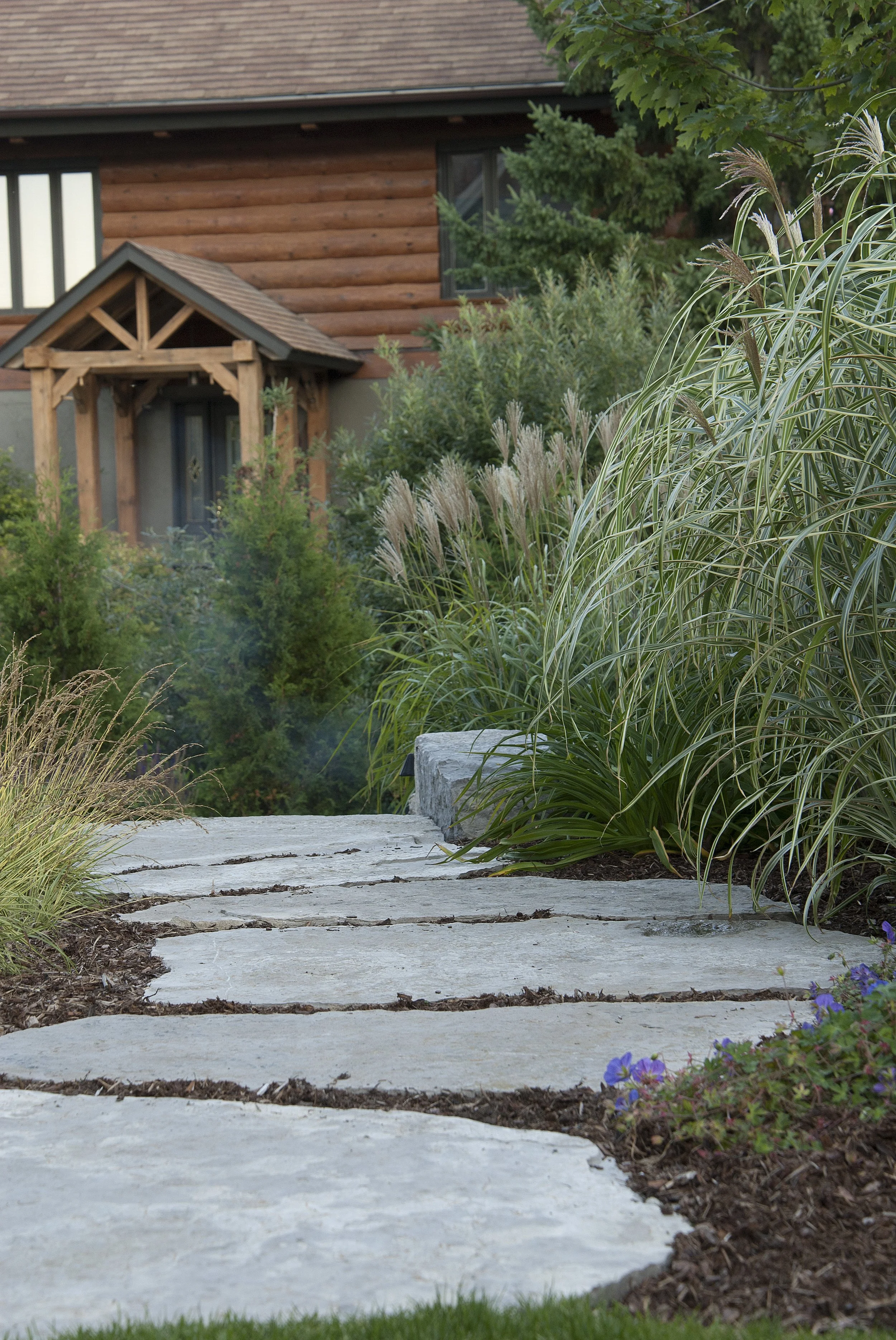 large limestone slabs leading through the back yard