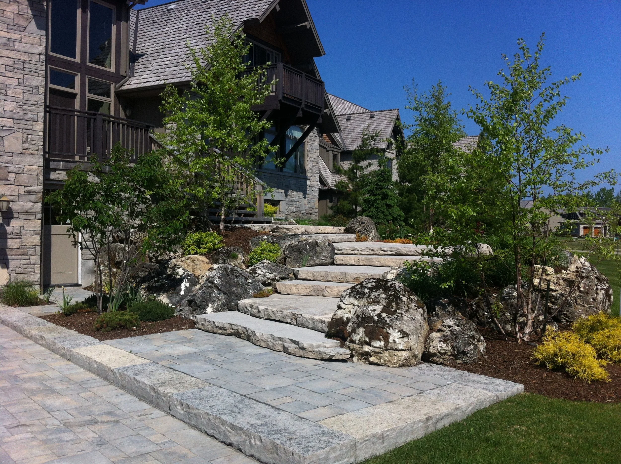 Natural stone entrance; steps, boulders& gardens