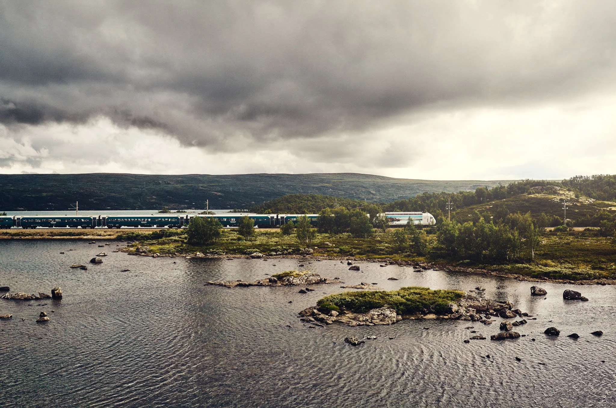 Vy train in  landscape near Finse, Bergen Line, Norway