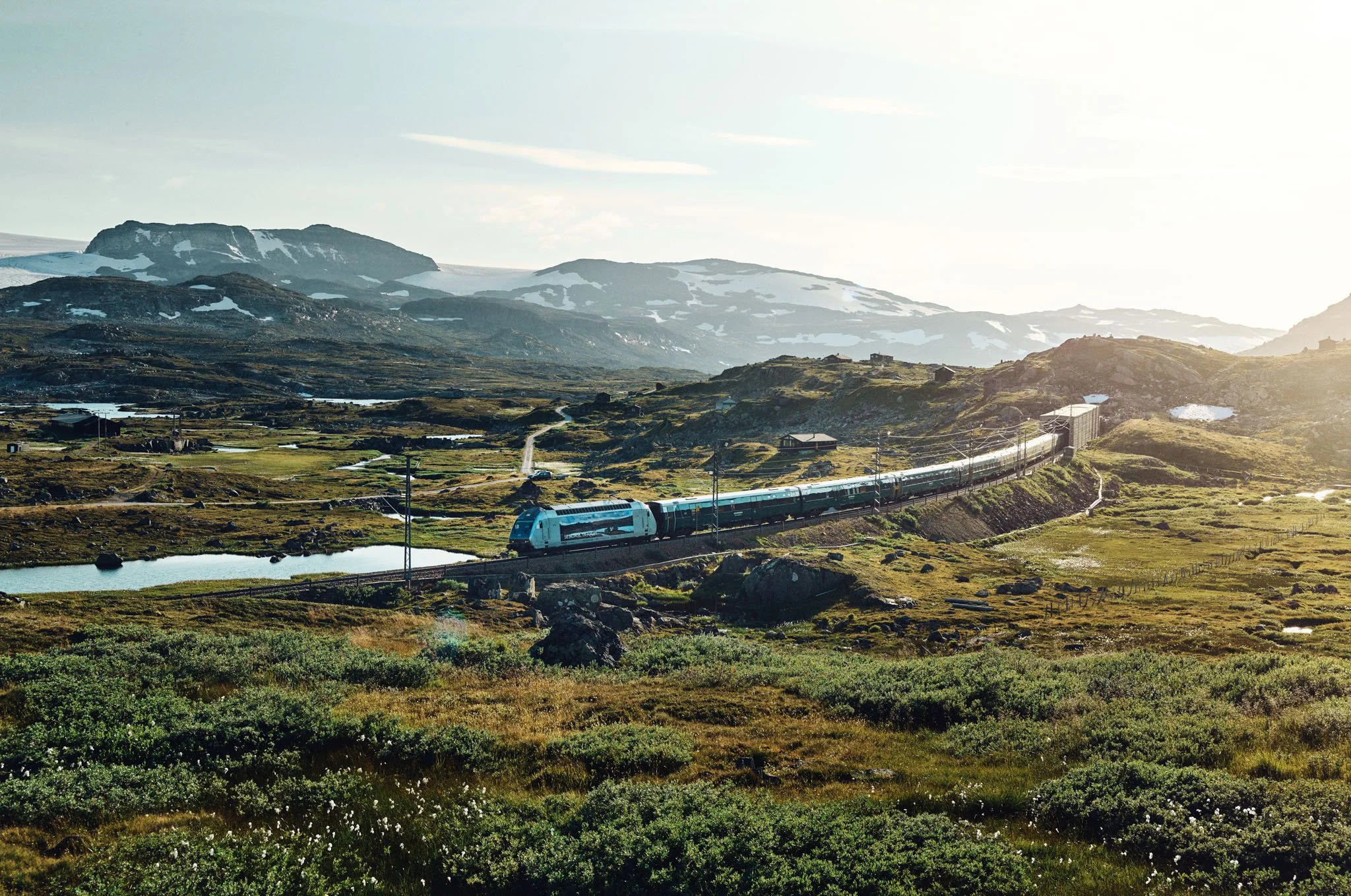 Vy train in landscape near Finse, Bergen Line, Norway