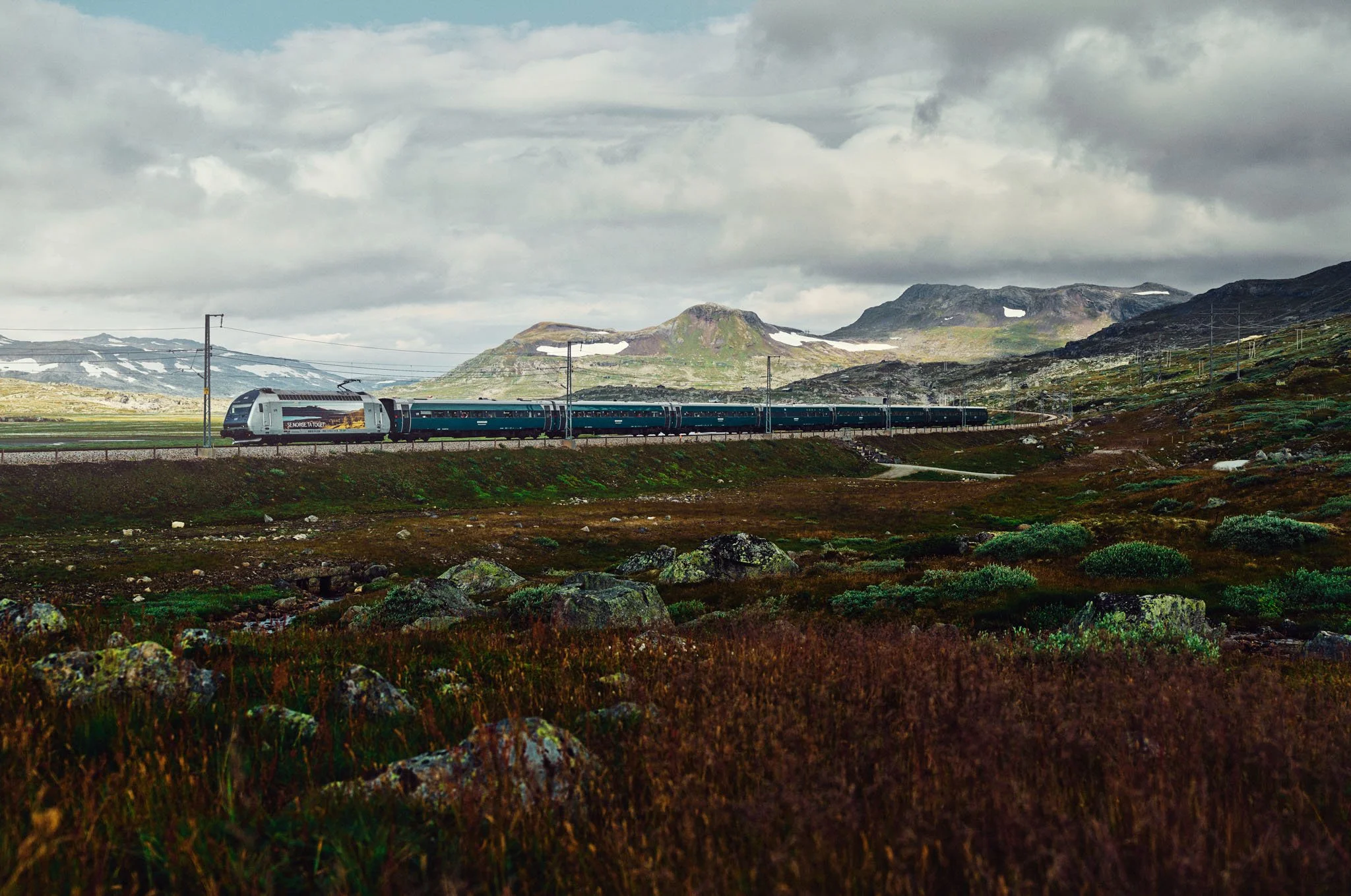 Vy train in landscape near Finse, Bergen Line, Norway