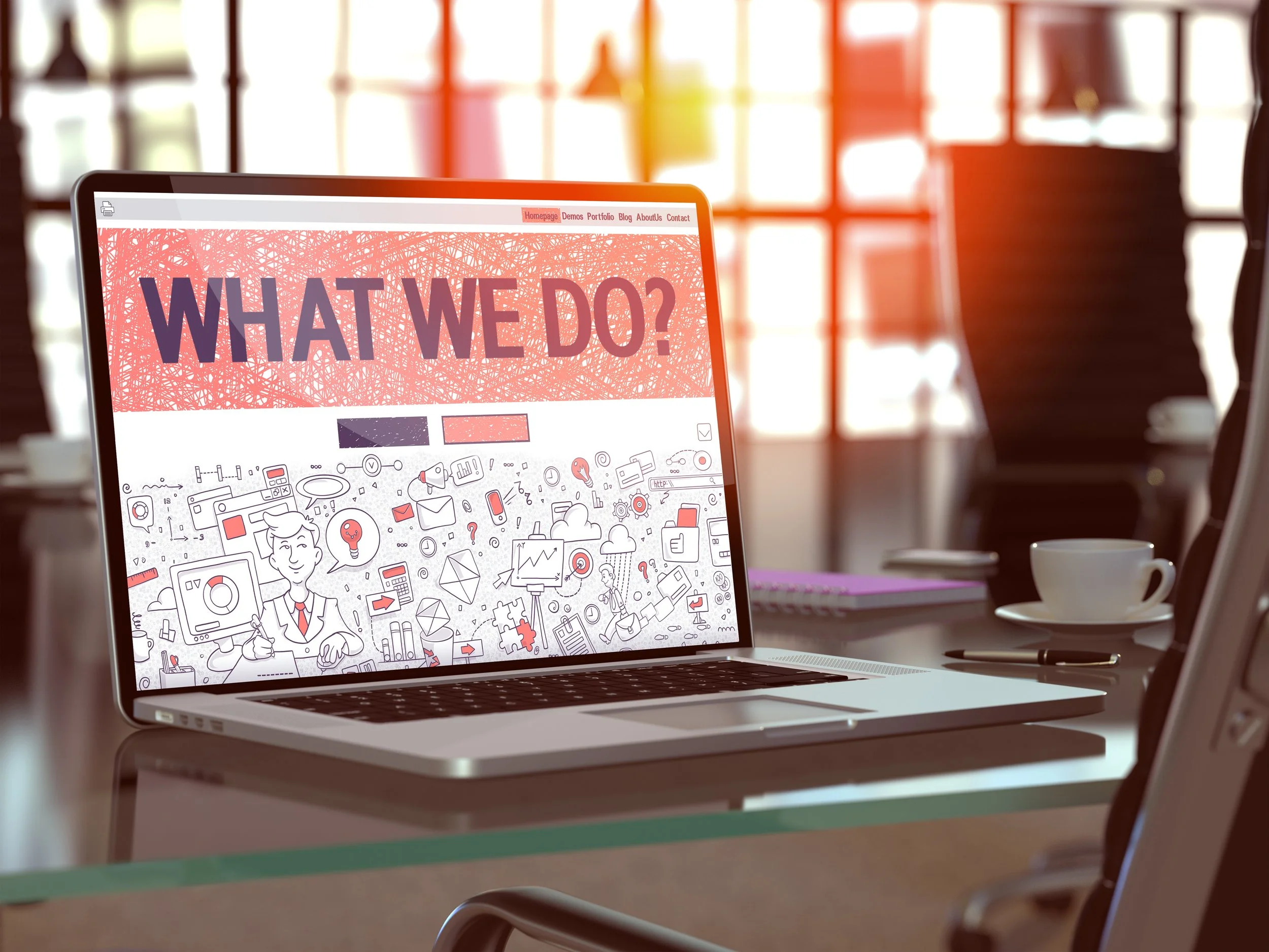 Laptop with the words what we do on the screen